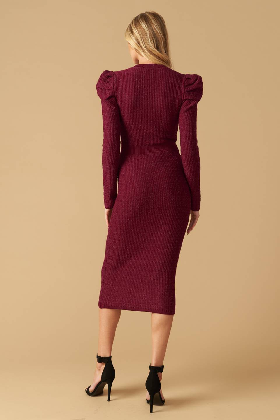 A sweater knit midi dress featuring V neckline, long puff sleeve and front button detail
Details:
Self : 45% Nylon 35% Viscose 20% Metallic
Size & Fit
- Model is 5`8" And Wearing Size Small
- Measurements Taken From Size Small
- Approx. Length: 47"