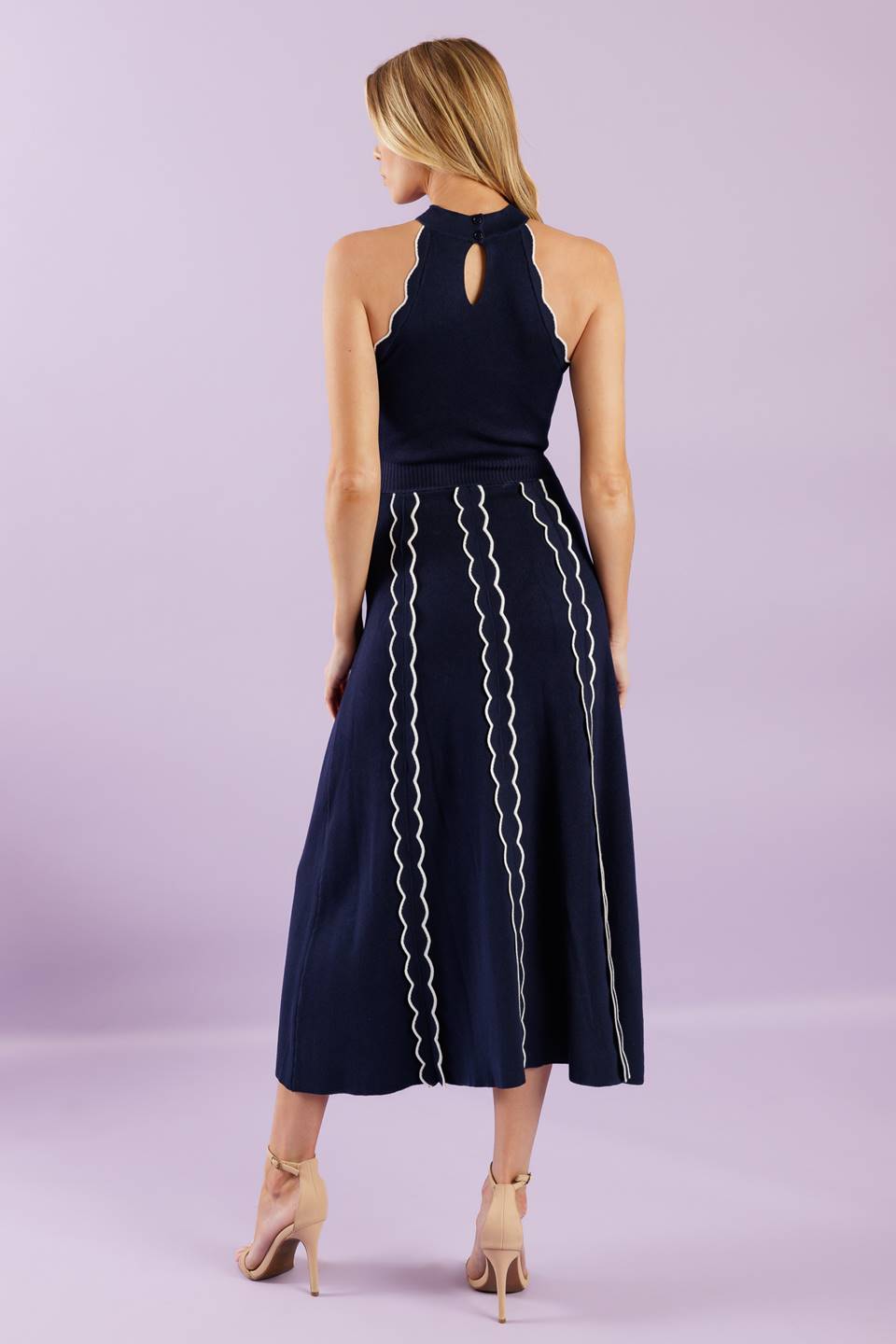 A solid sweater knit midi dress featuring halter neckline and back neck button closure
Details:
Self : 75% Viscose 25% Nylon
Size & Fit
- Model is 5`8" And Wearing Size Small
- Measurements Taken From Size Small
- Approx. Length: 55"