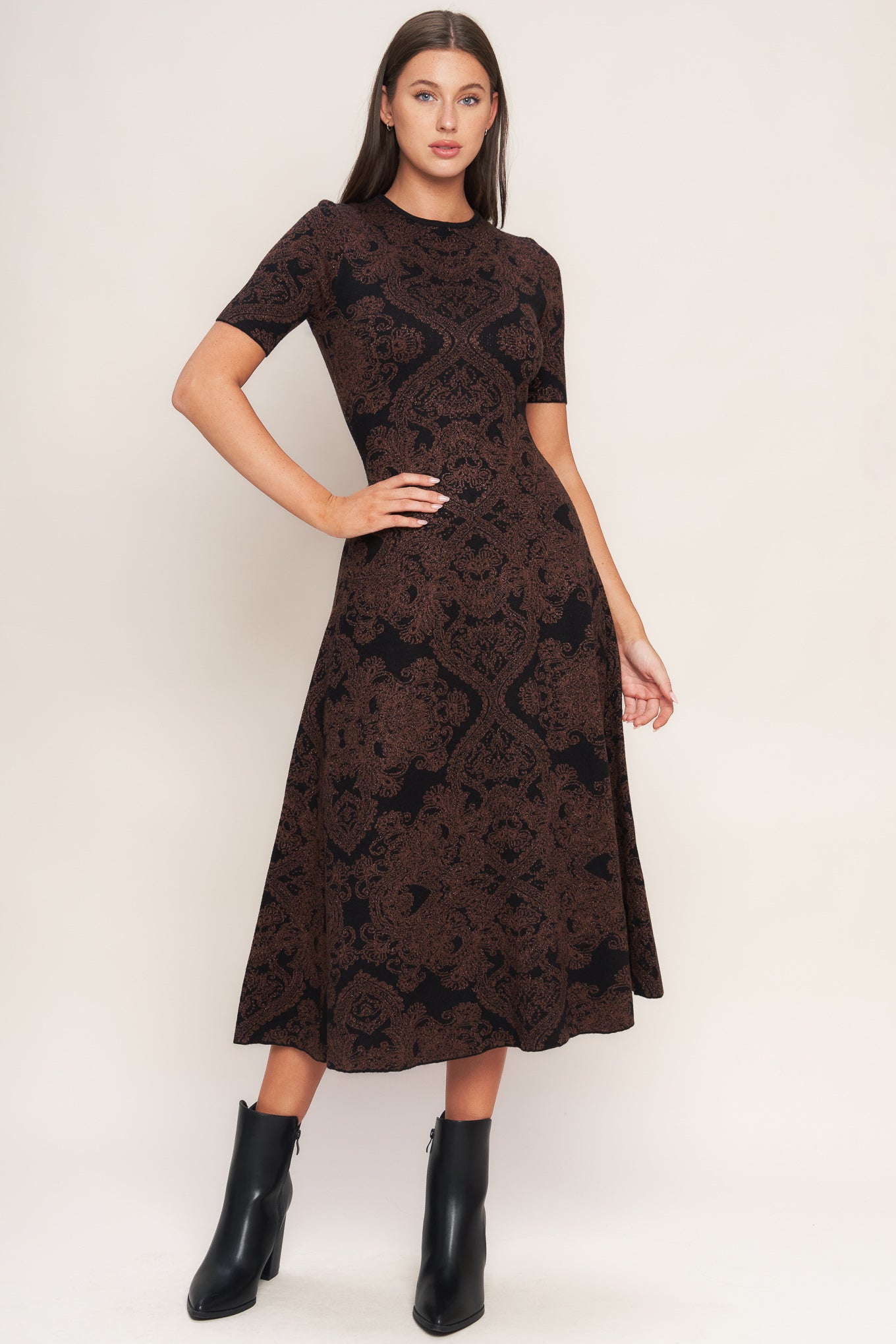 A jacquard sweater midi dress featuring crew neckline, short sleeve, circle skirt and back neck zipper closure
