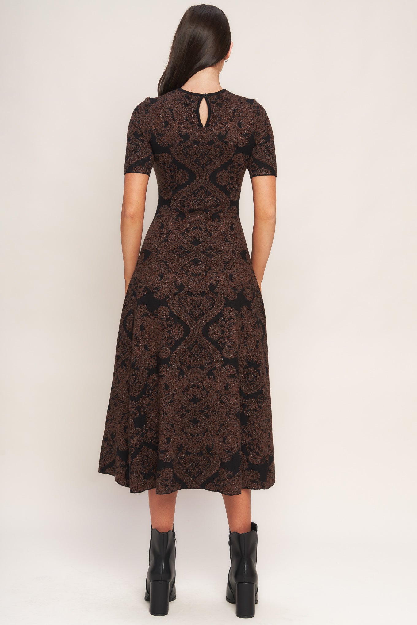 A jacquard sweater midi dress featuring crew neckline, short sleeve, circle skirt and back neck zipper closure