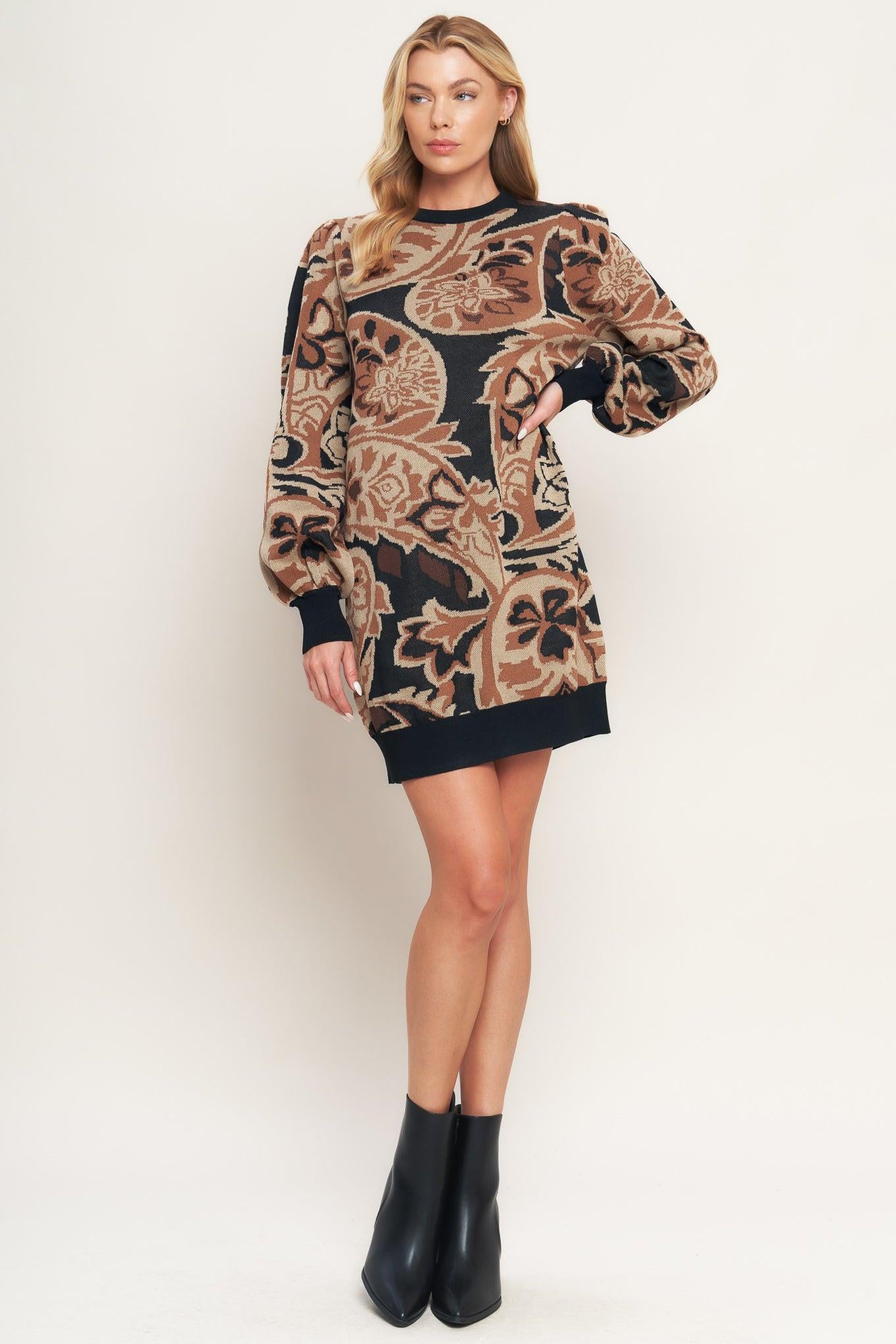A sweater knit mini dress featuring crew neckline and long blouson sleeve