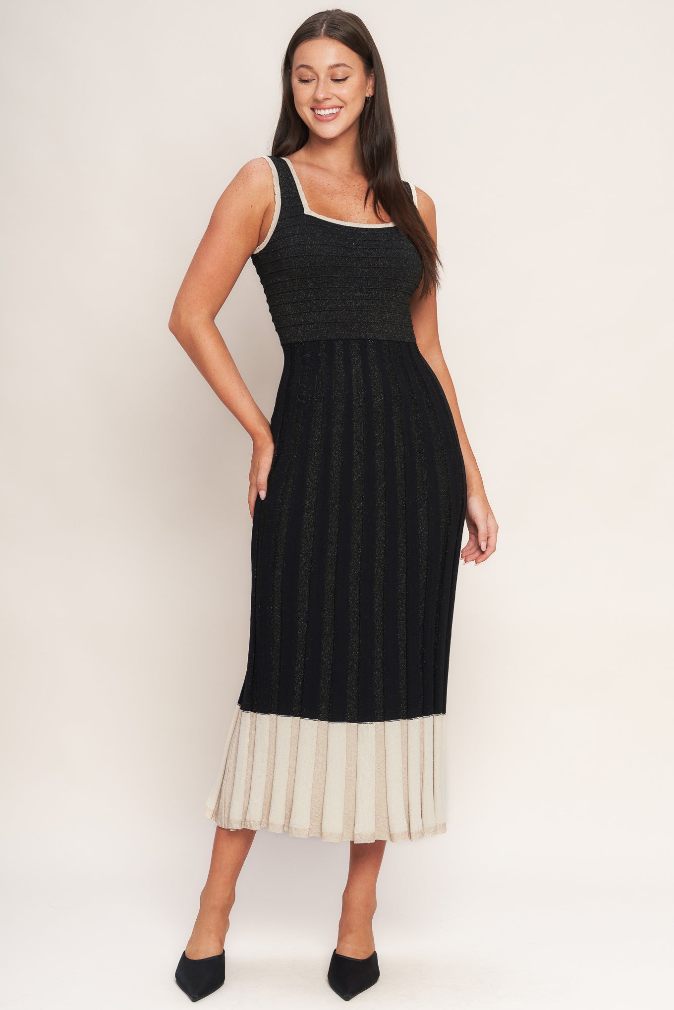 A sweater knit midi dress featuring square neckline, sleeveless and body contouring