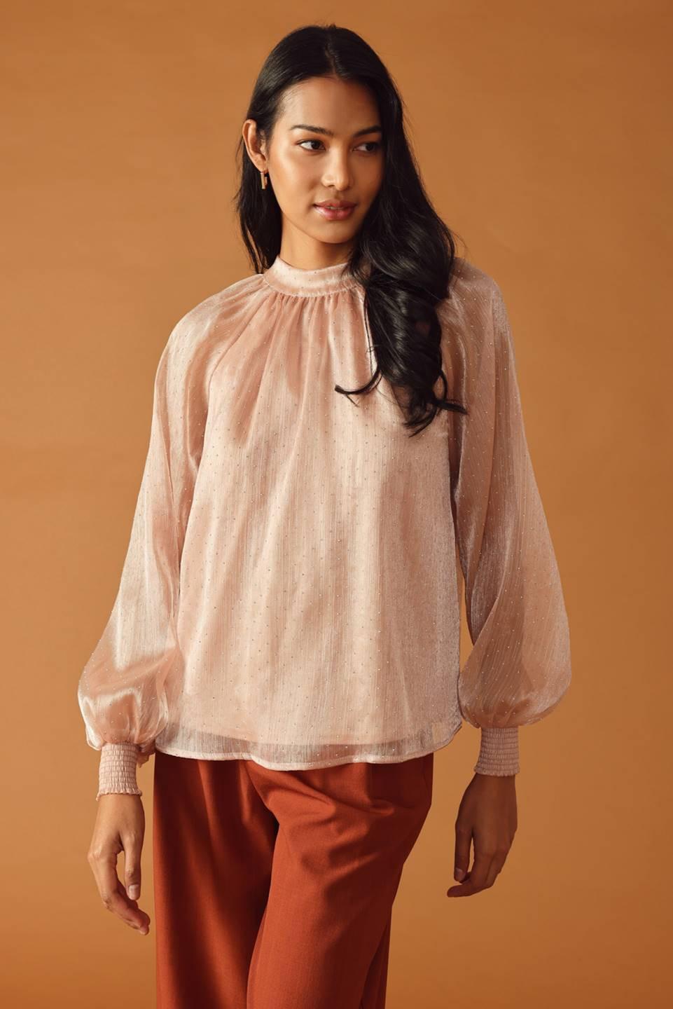 HIGHLY UNPREDICTABLE WOVEN TOP.