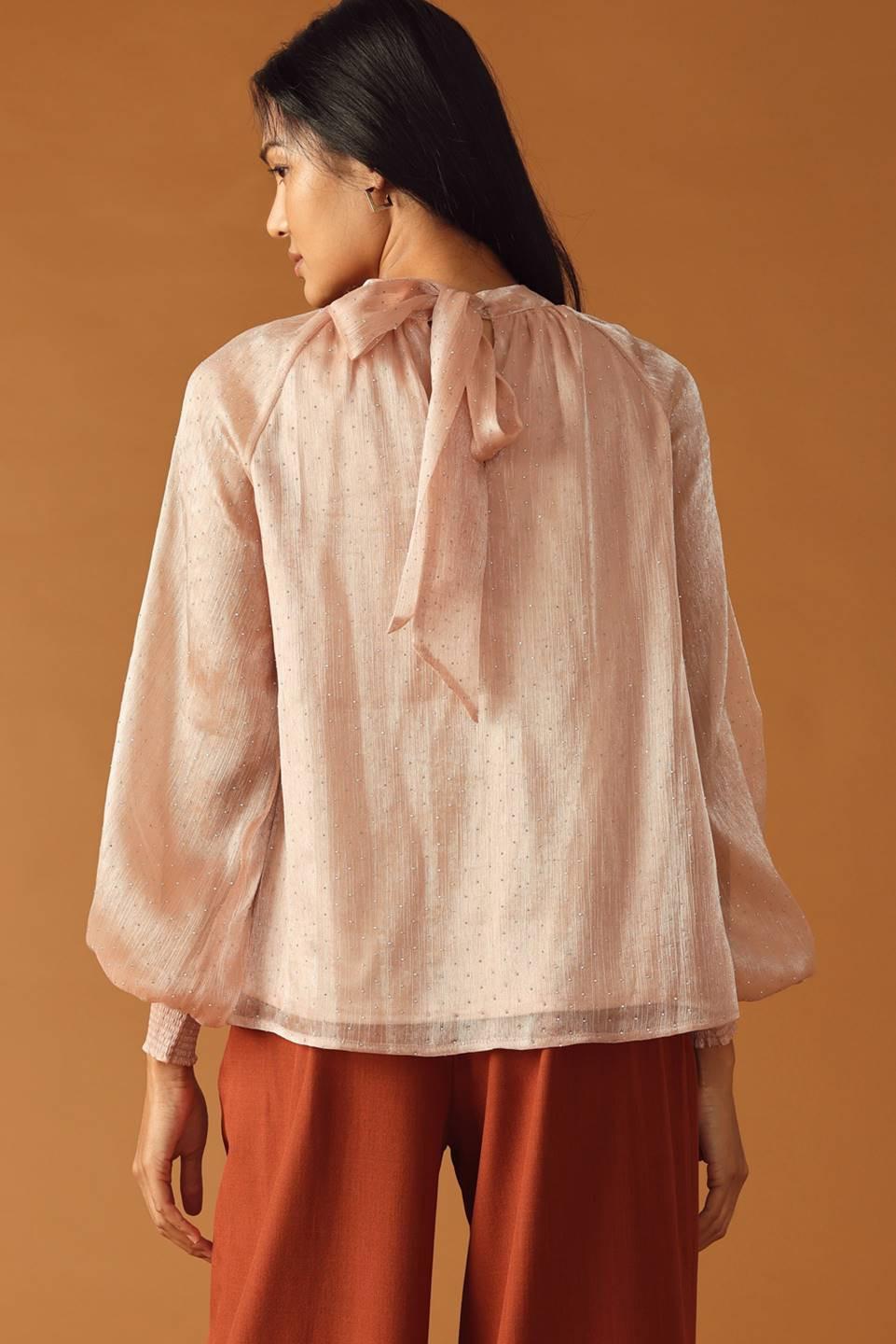 HIGHLY UNPREDICTABLE WOVEN TOP.