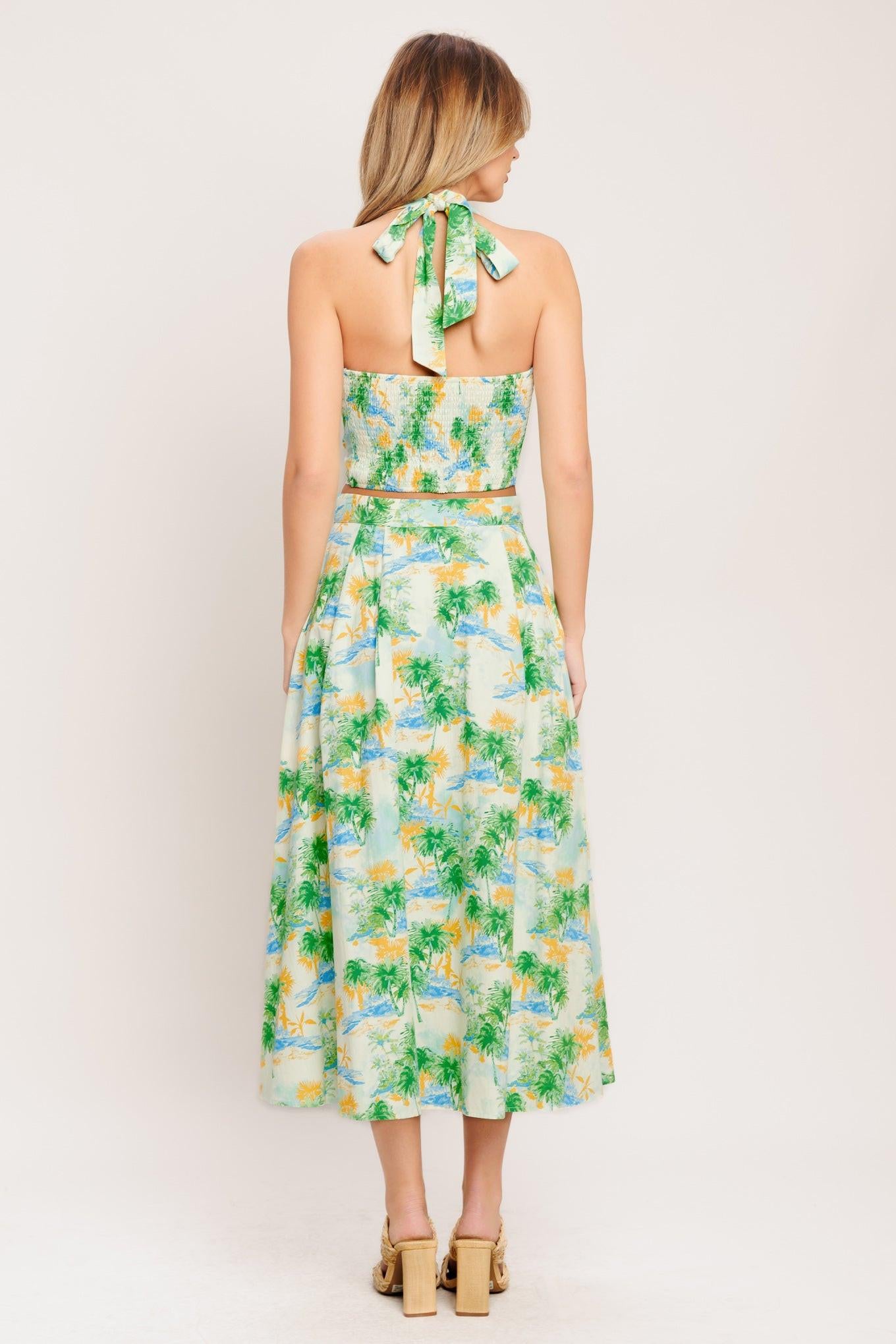 A printed woven top and skirt set. Top featuring halter neckline with smocked back bodice. Full skirt with front button down.
Details:
Self : 100% Cotton
Lining : 100% Polyester
Size & Fit
- Model is 5`8" And Wearing Size Small
- Measurements Taken From Size Small
- Approx. Length: 18" (TOP)
- Approx. Length: 34" (BOTTOM)
