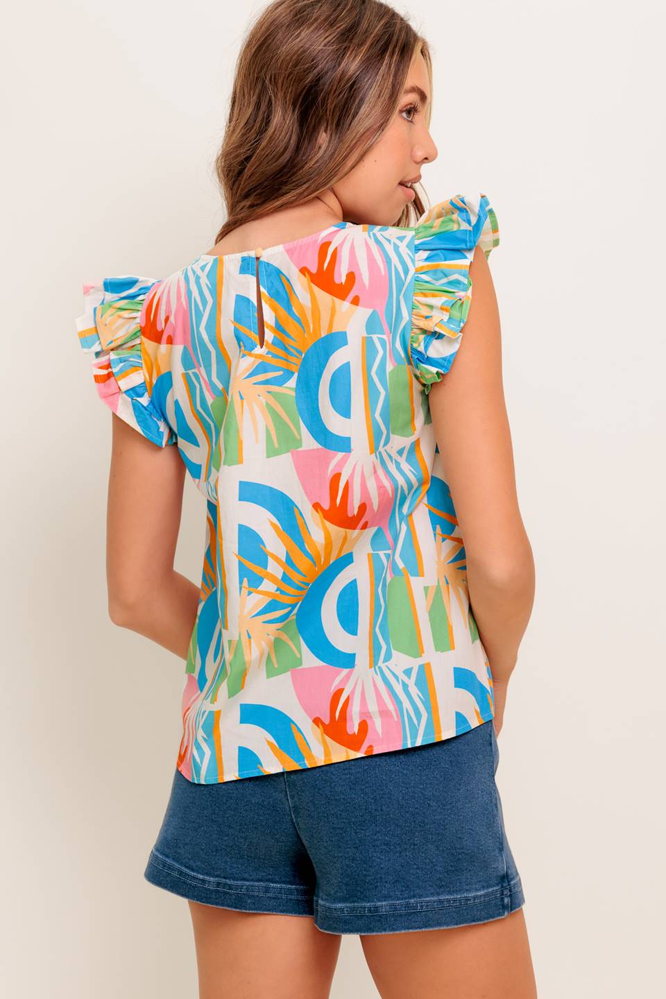 A printed woven top featuring round neckline, double ruffled sleeve and back keyhole button closure