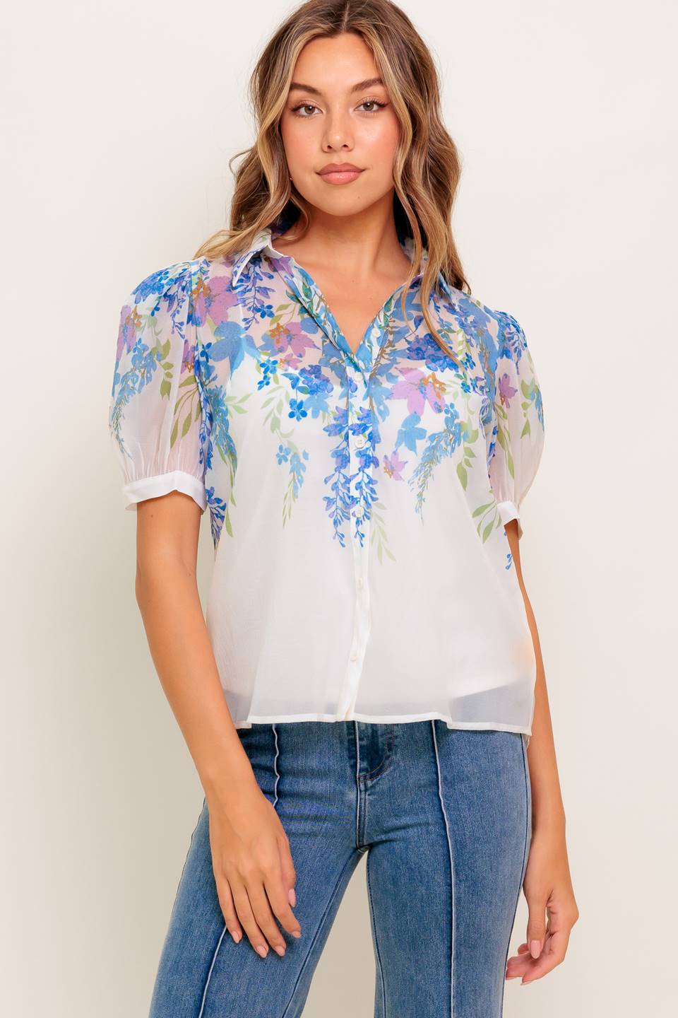 A printed woven top featuring collar, short sleeve, button down and cami.