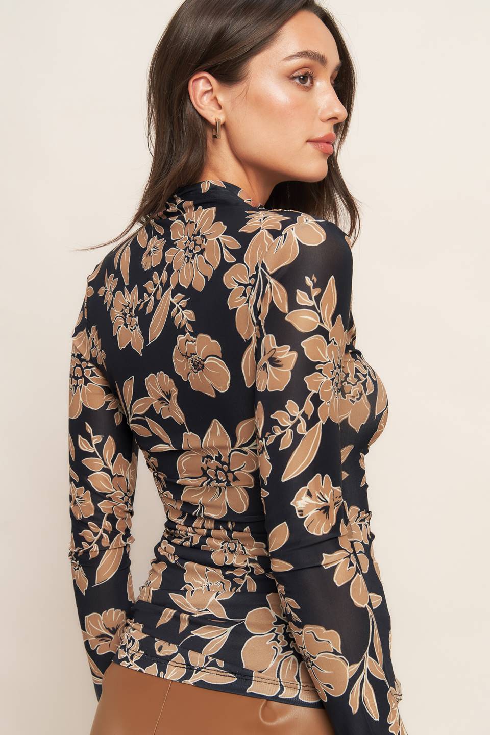 A printed power mesh top with high neckline and long sleeve