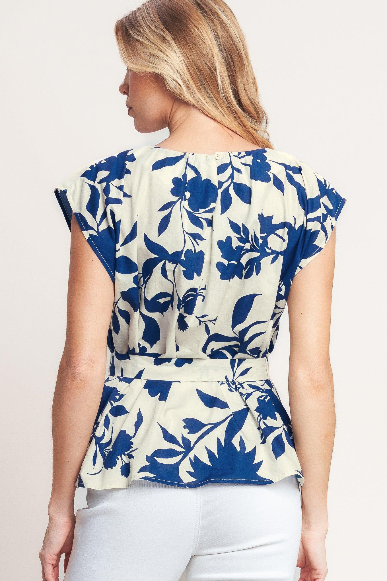 A printed woven top featuring round neckline, short sleeve, self sash tie and back neck button closure
Details:
Self: 100% Cotton
Size & Fit
-Model is 5`8" And Wearing Size Small
-Measurements Taken From Size Small
-Approx. Length: 24"
