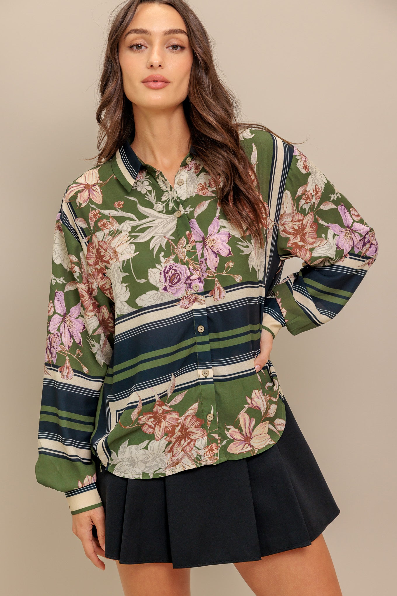 A printed woven top with collar, button down and long sleeve