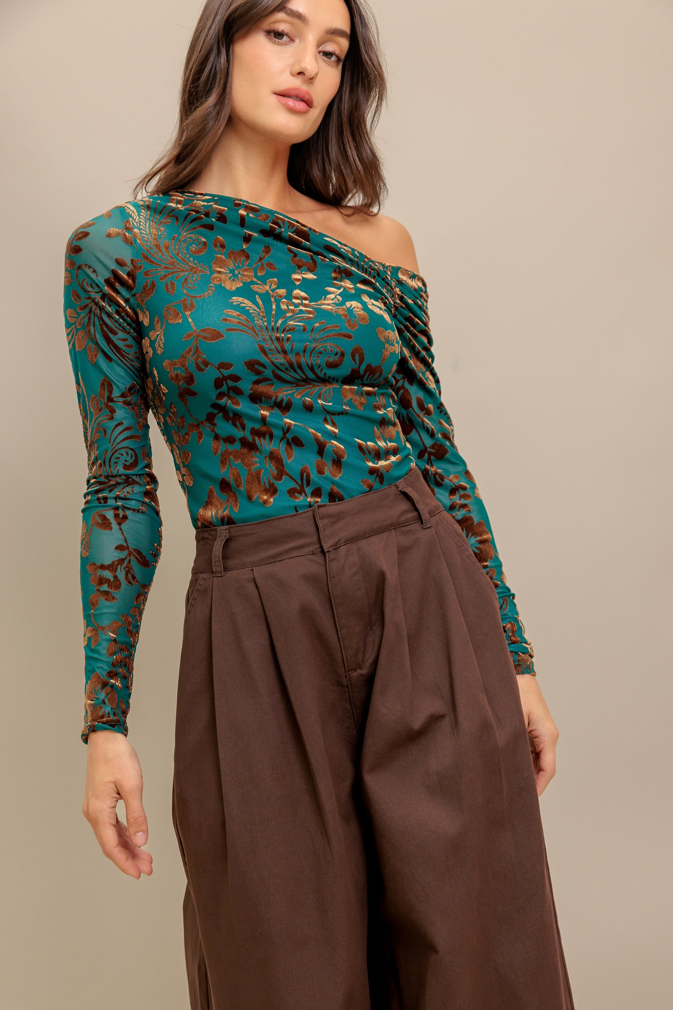 A flocked knit to featuring one side off shoulder and long sleeve