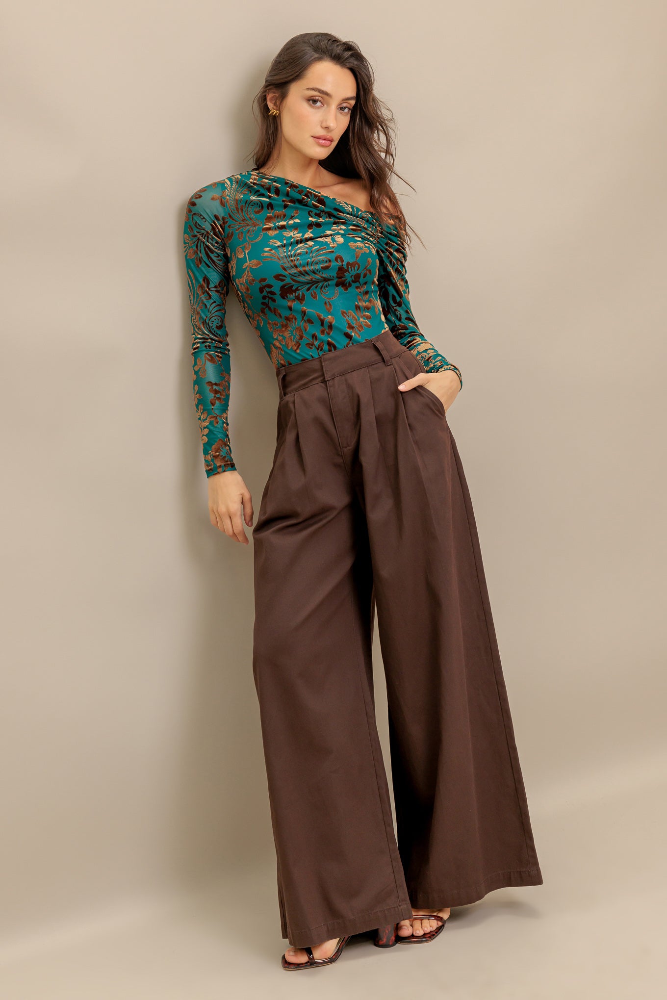 A flocked knit to featuring one side off shoulder and long sleeve