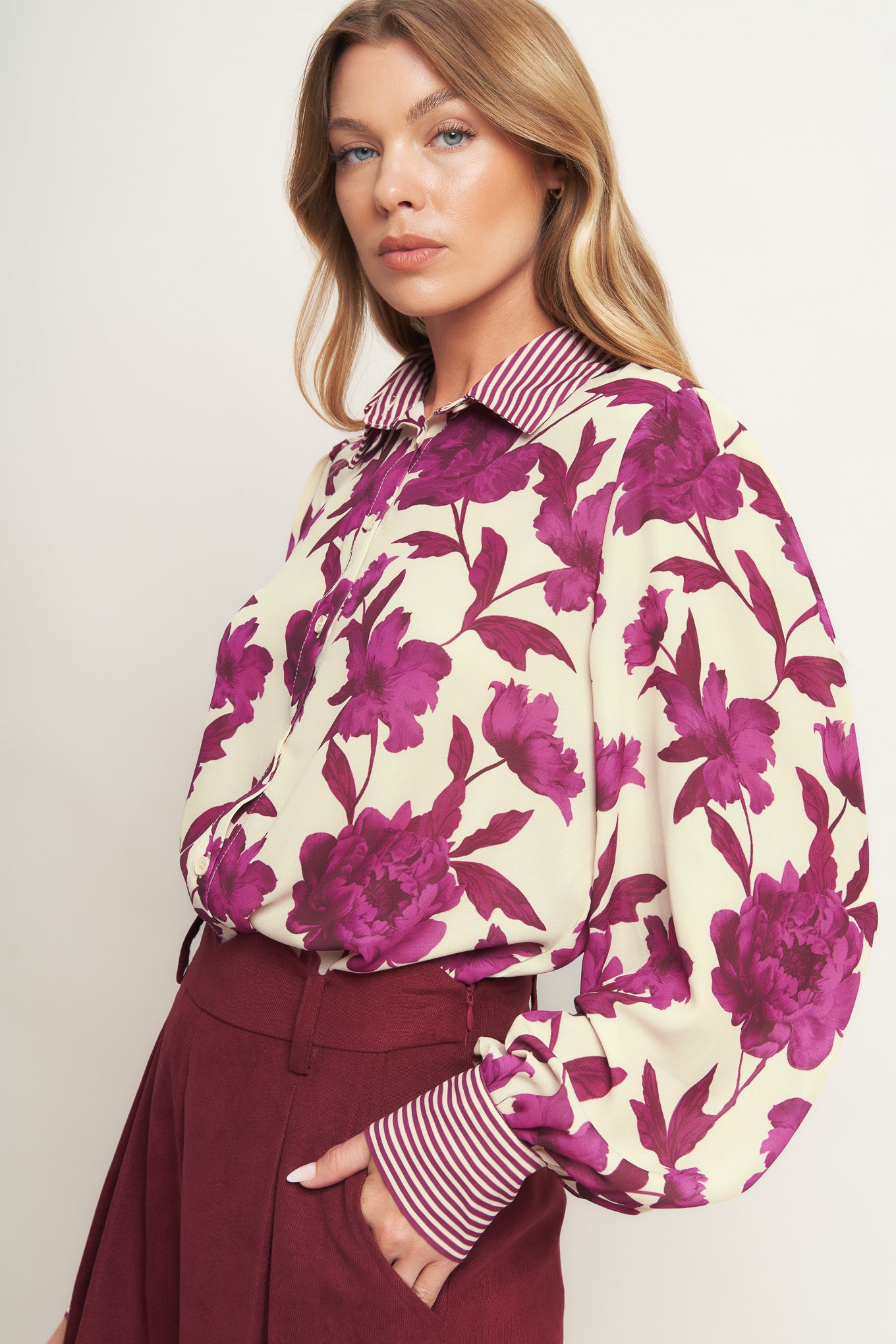 A printed woven top with collar, button down and long sleeve