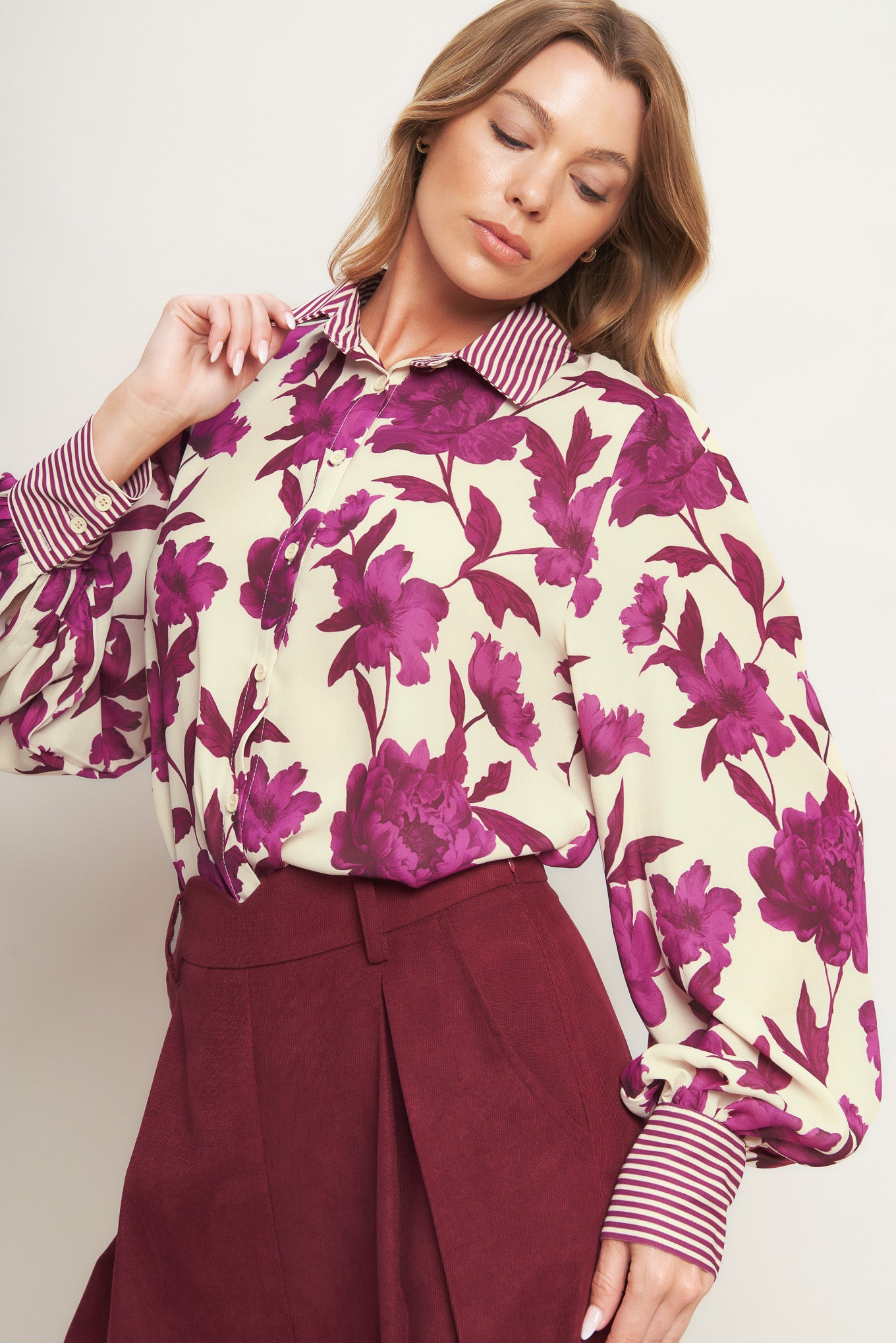 A printed woven top with collar, button down and long sleeve
