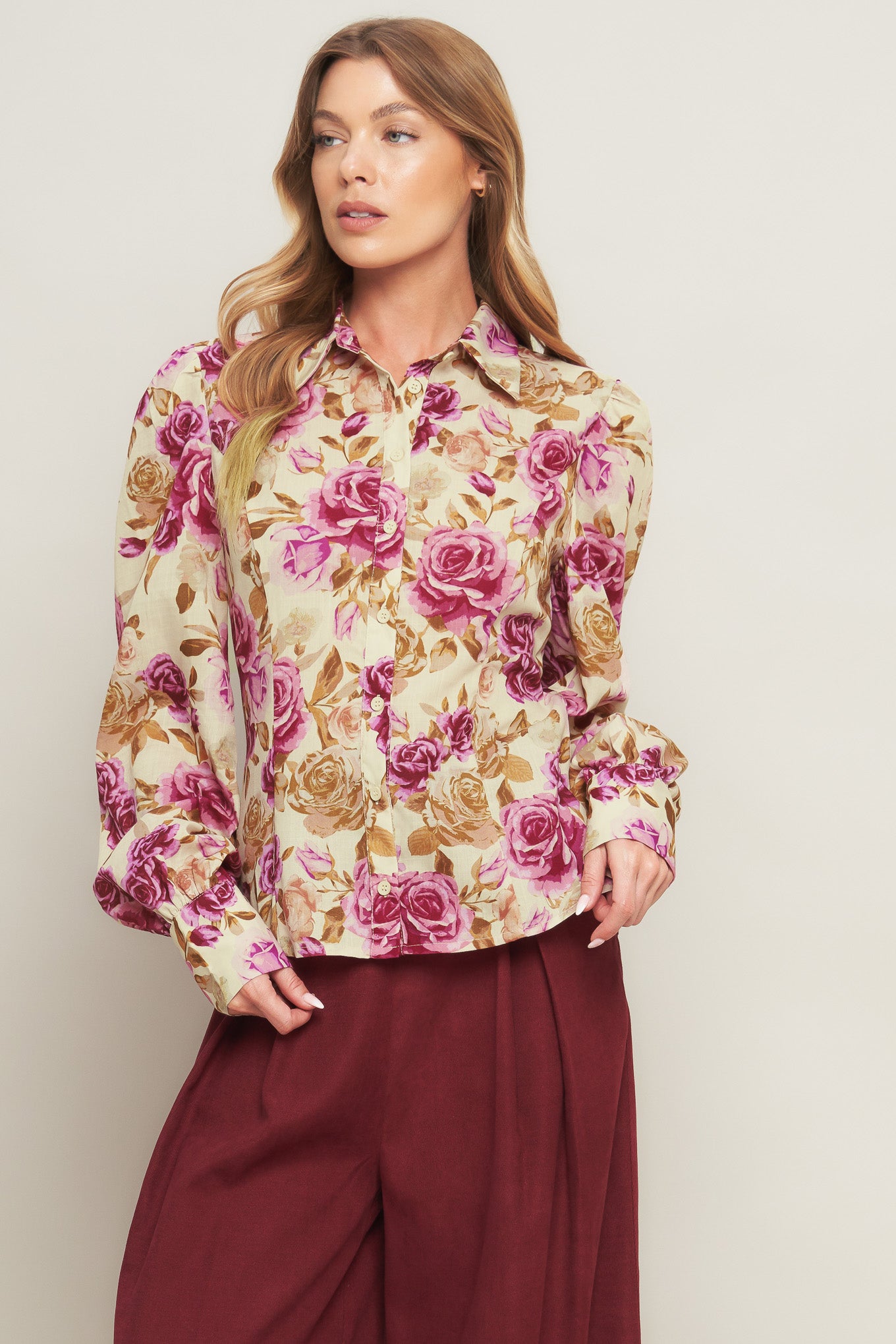 A printed woven top featuring collar, long sleeve and button down