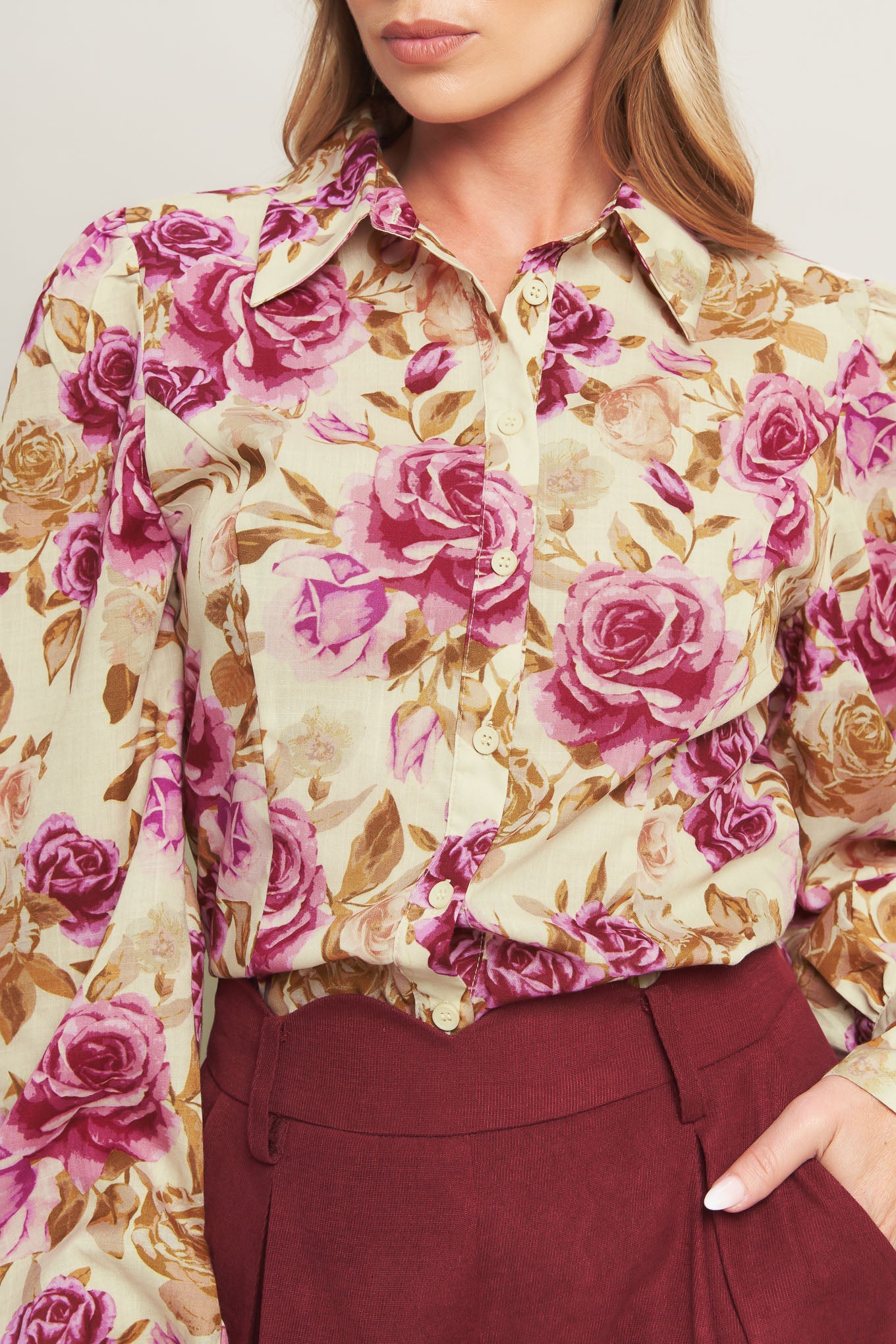 A printed woven top featuring collar, long sleeve and button down