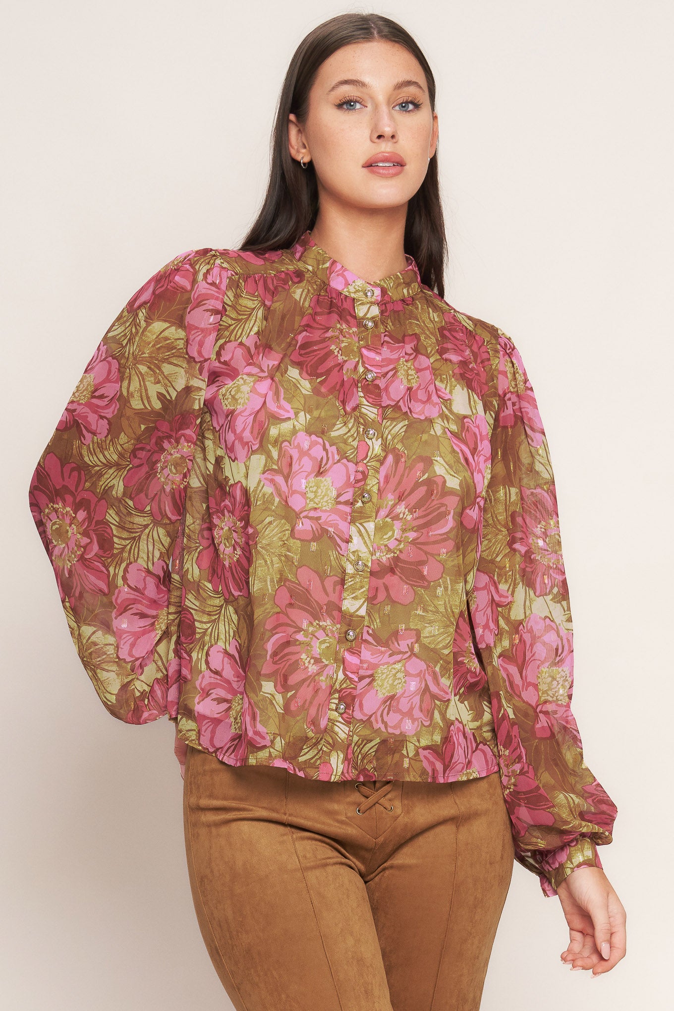 A printed woven top featuring china collar, long sleeve, front button down