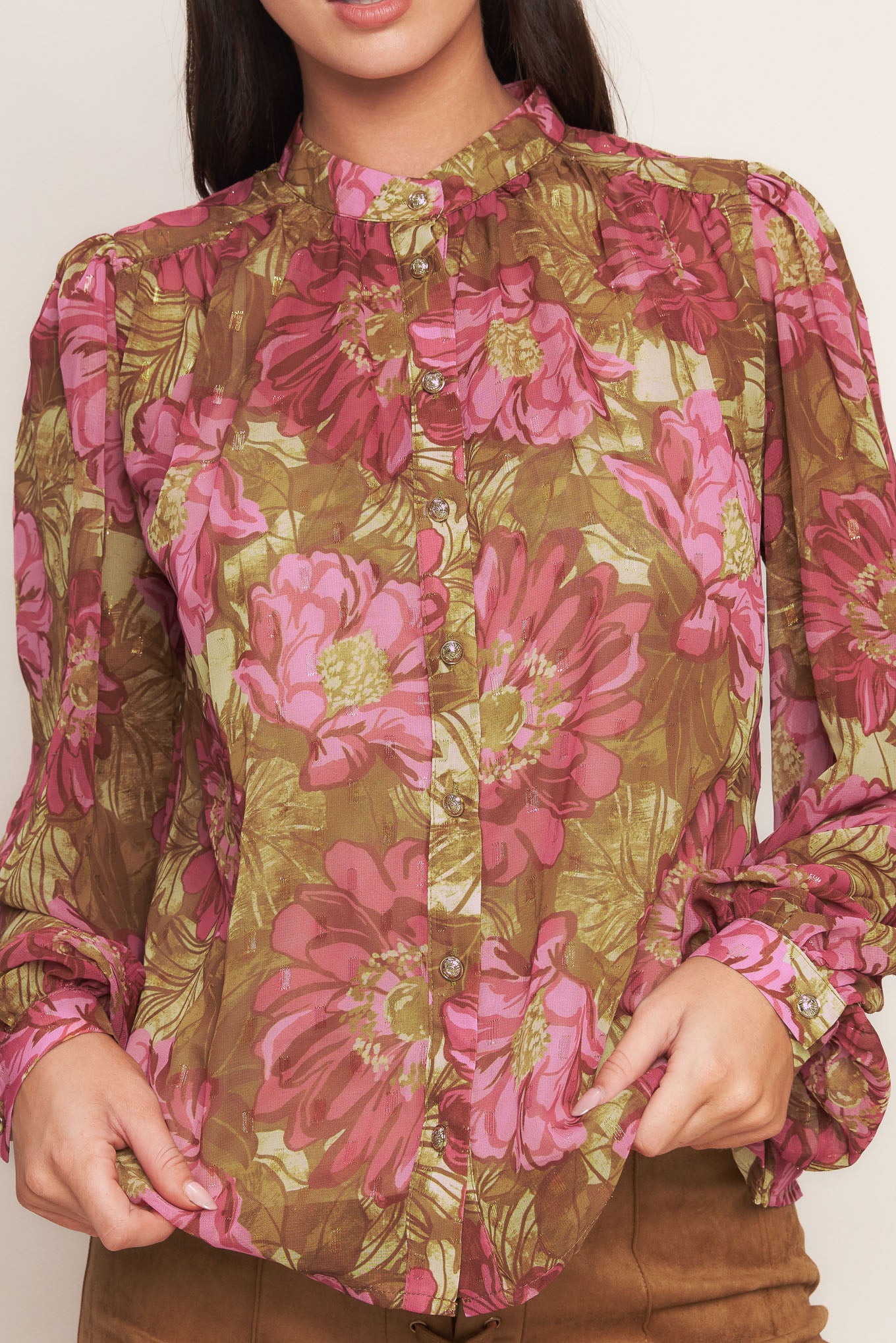 A printed woven top featuring china collar, long sleeve, front button down