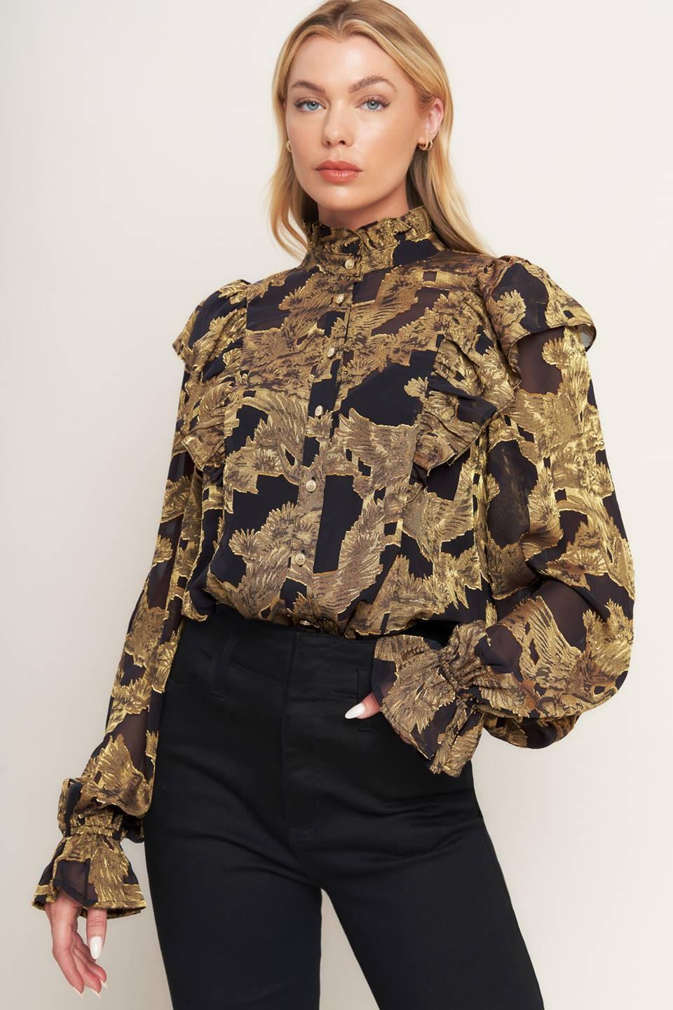 A jacquard woven top featuring high ruffled neckline, front button down, ruffle over shoulder and long sleeve with ruffled cuff