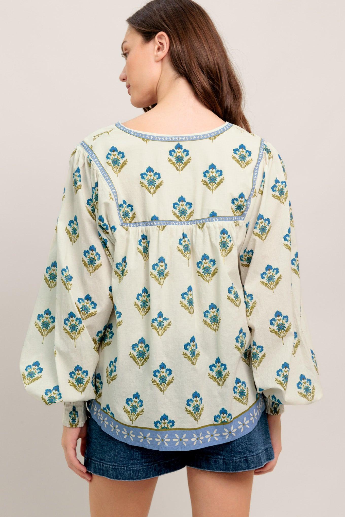 A printed woven top featuring V neckline with tie, yoke and long sleeve with smocked cuff
Details:
Self : 100% Cotton
Lining : 100% Polyester
Size & Fit
- Model is 5`8" And Wearing Size Small
- Measurements Taken From Size Small
- Approx. Length: 25" FLYING TOMATO