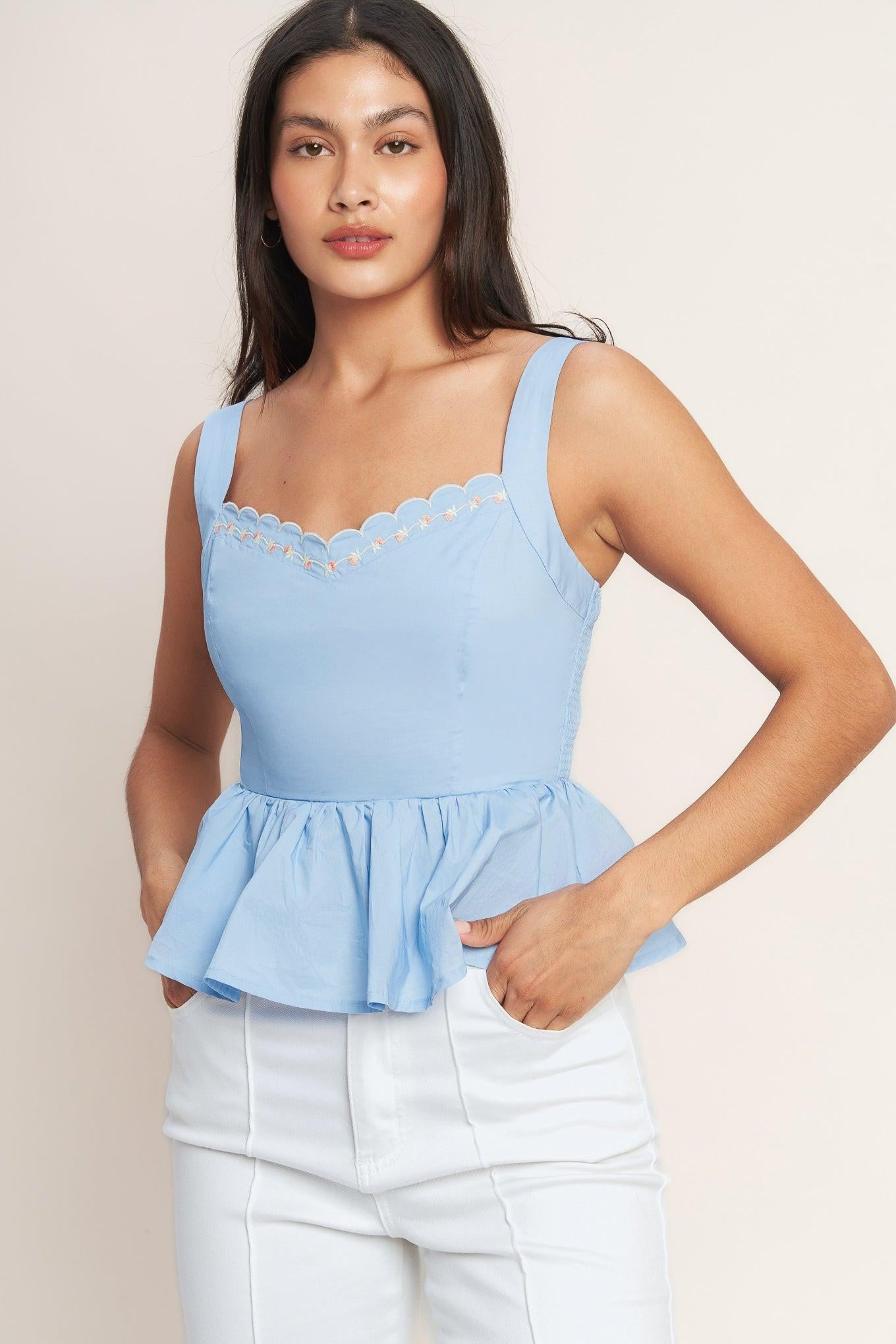 A solid woven top featuring V neckline with scallop edge and embroidery, peplum and smocked back bodice. Matching skirt IK7770T
Details:
Self : 100% Cotton
Lining : 100% Polyester
Size & Fit
- Model is 5`8" And Wearing Size Small
- Measurements Taken From Size Small
- Approx. Length: 21"