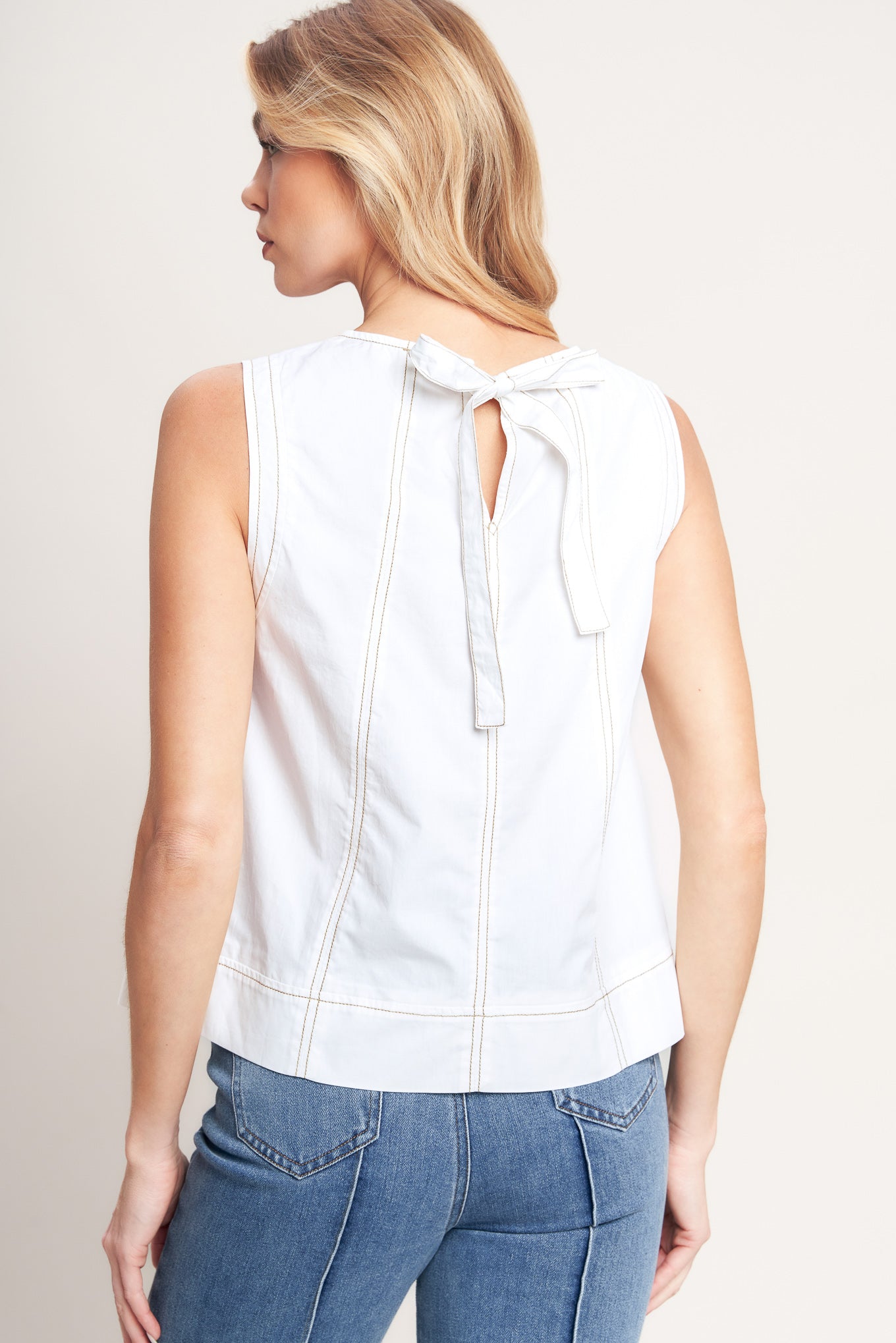 A solid woven top featuring round neckline, sleeveless and back neck tie closure
Details: Self : 100% Cotton
Size & Fit
-Model is 5`8" And Wearing Size Small
-Measurements Taken From Size Small
-Approx. Length: 21"