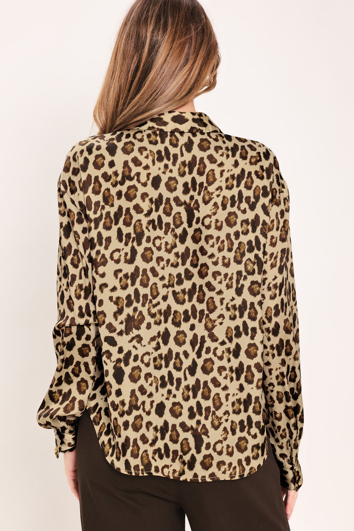Woman wearing a long sleeve leopard print button down blouse top with collar | Flying Tomato