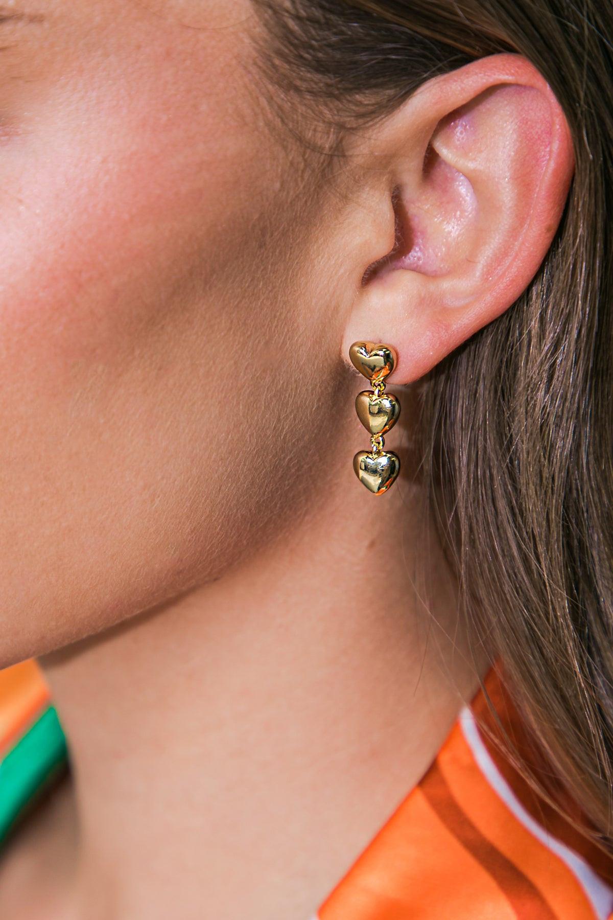 TRIPLE HEART DROP CLIP-ON EARRINGS.