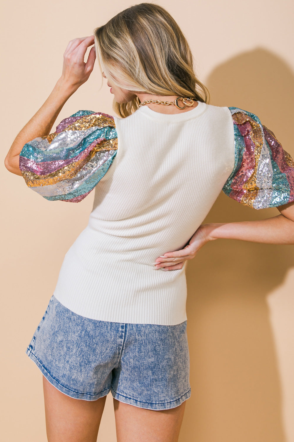 This luxurious knit sweater boasts a delicate round neckline and striking sequin sleeves that add a touch of sophistication and elegance.
Details:
Self : 66% Acrylic 25% Polyester 7% Nylon 2% Wool
Contrast : 96% Polyester 4% Spandex
Lining : 100% Polyester
Size & Fit
- Model is 5`8" And Wearing Size Small
- Measurements Taken From Size Small
- Approx. Length: 24"