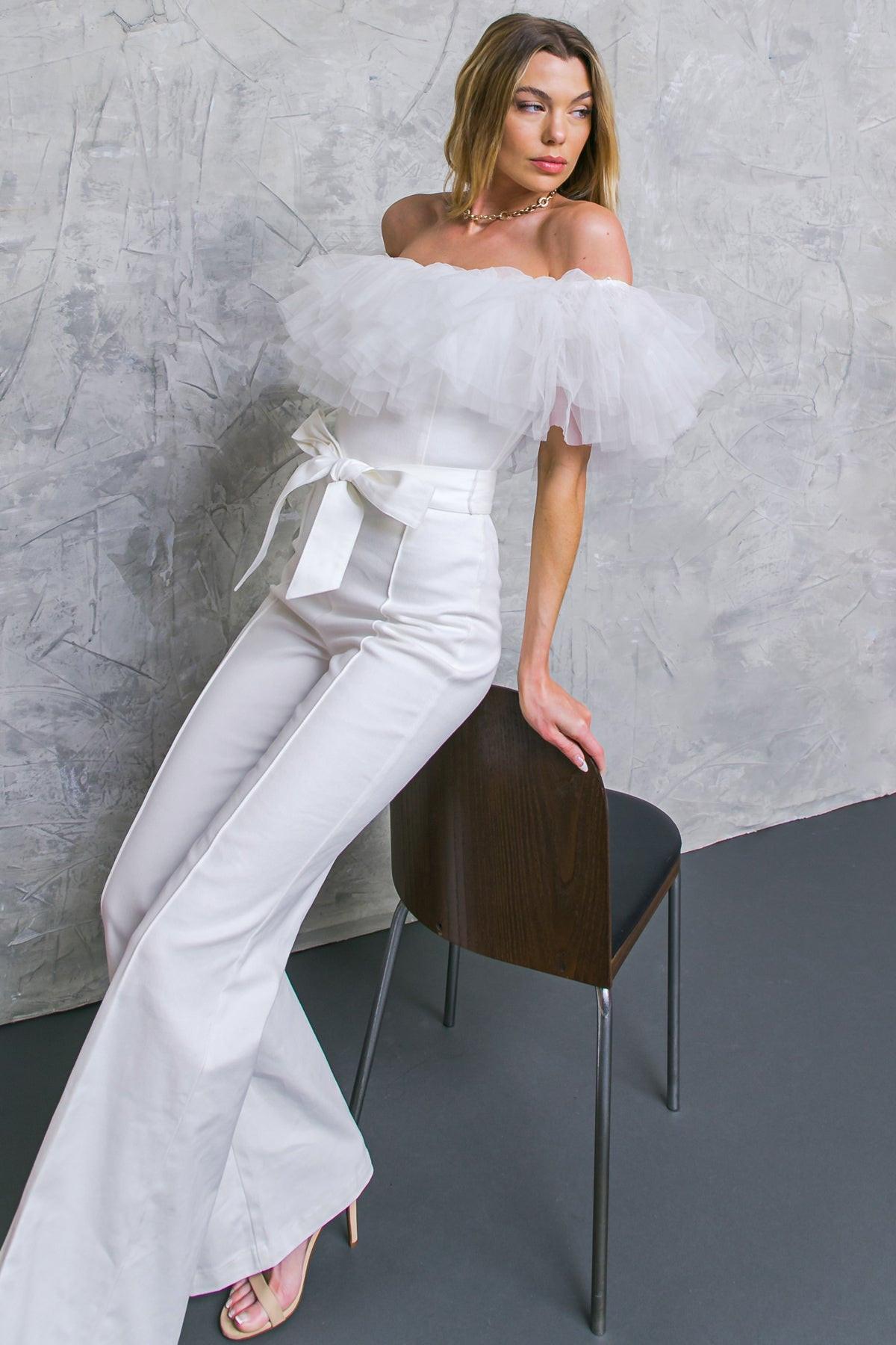 A POWER MOOD WHITE DENIM JUMPSUIT.