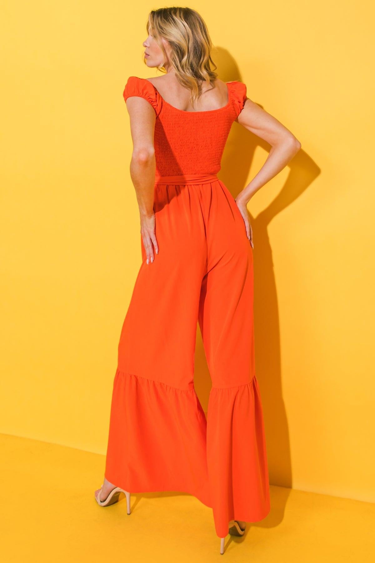 SMILE AFTERNOON IN WOVEN JUMPSUIT.