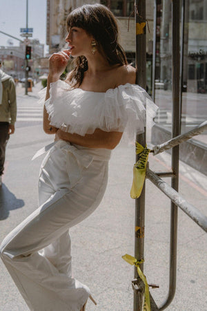 A POWER MOOD WHITE DENIM JUMPSUIT.