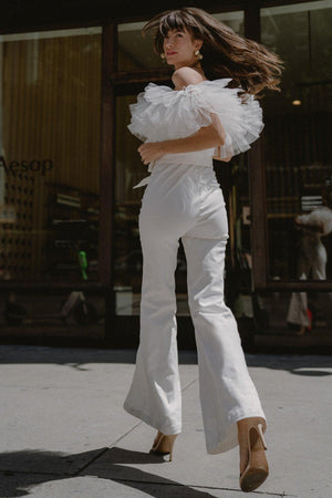 A POWER MOOD WHITE DENIM JUMPSUIT.