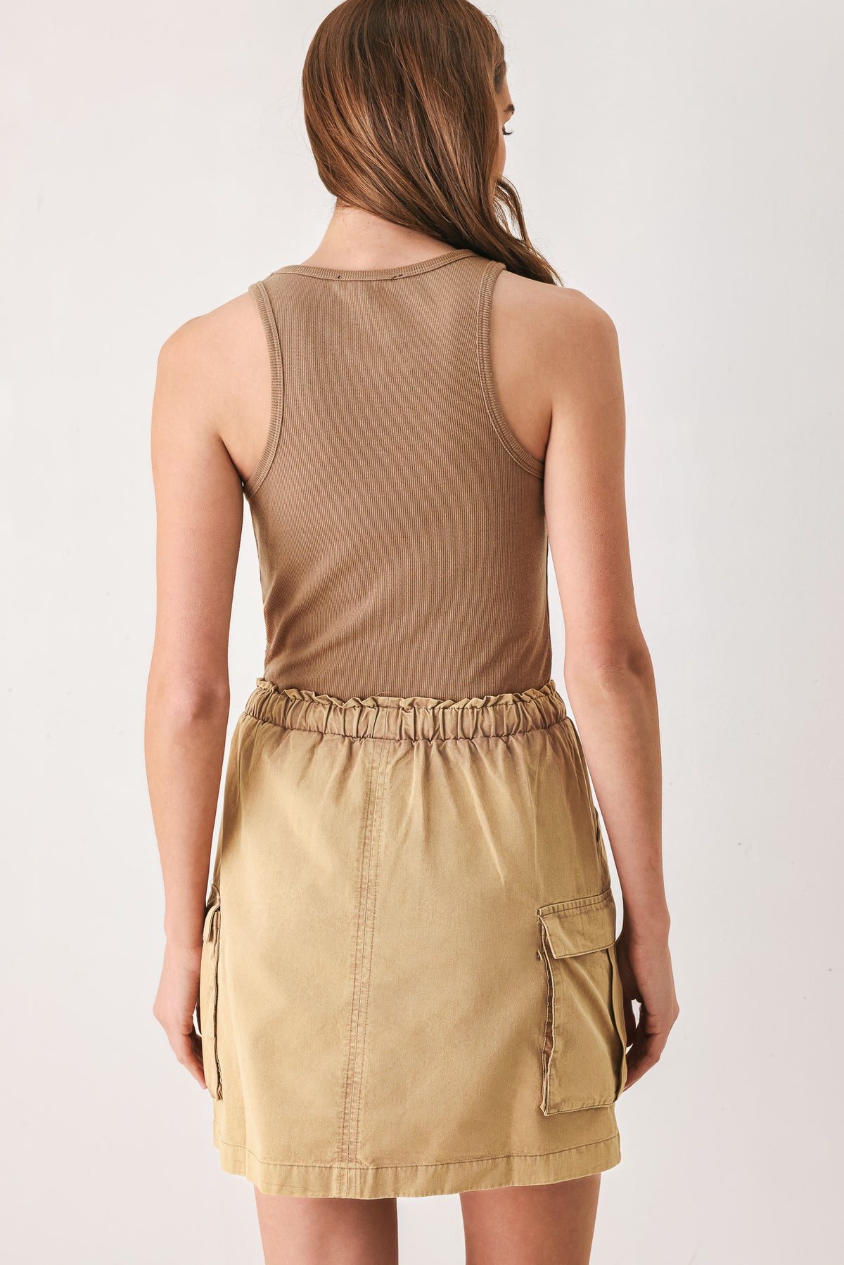 Woman wearing a camel cargo mini skirt | FREEMARKET