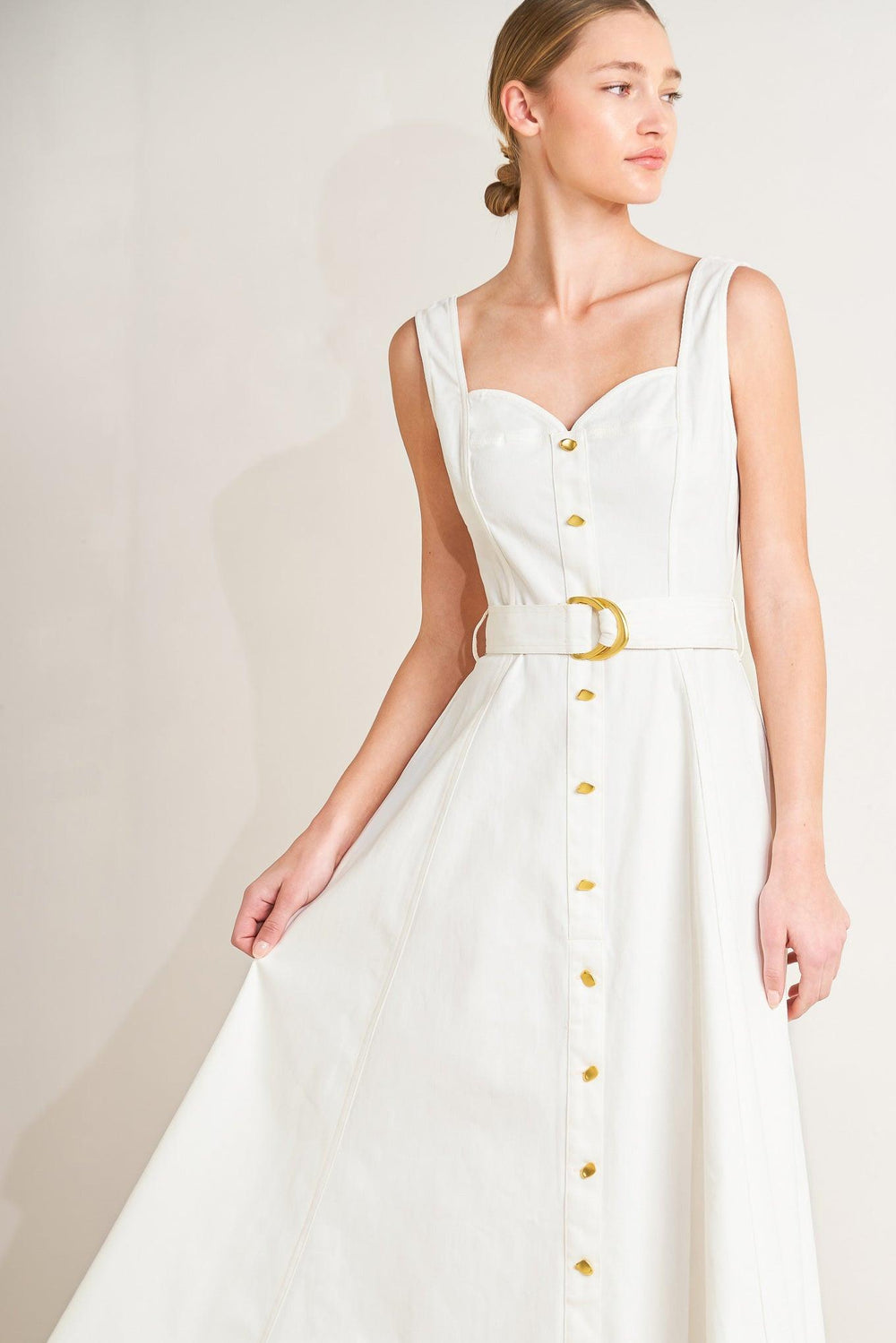 
A solid woven midi dress featuring sweetheart neckline, sleeveless, front button down, self belt and circle skirt

Details:

Self : 97% Cotton 3% Spandex

Size &amp; Fit

- Model is 5`8" And Wearing Size Small
- Measurements Taken From Size Small
- Approx. Length: 49"