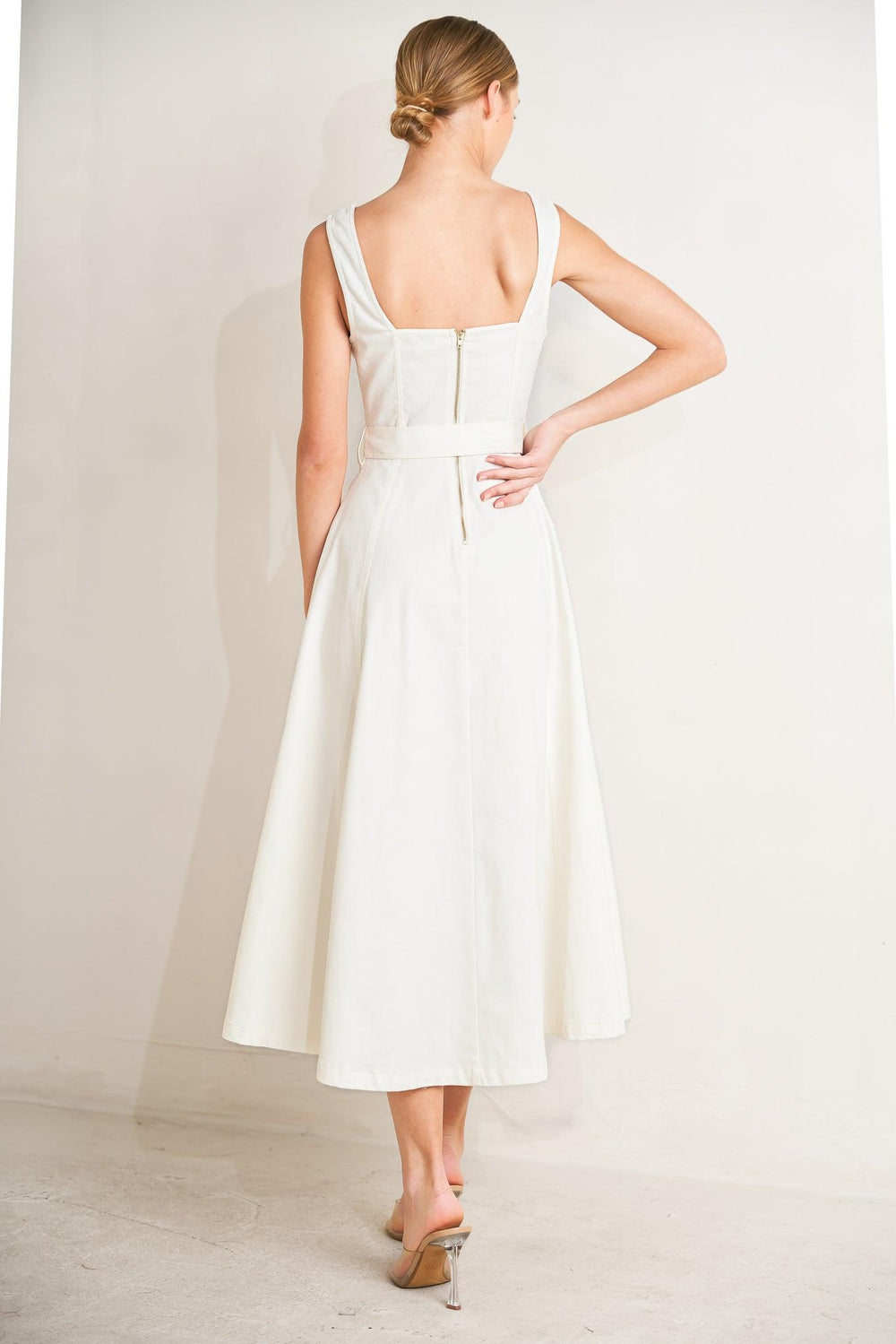 
A solid woven midi dress featuring sweetheart neckline, sleeveless, front button down, self belt and circle skirt

Details:

Self : 97% Cotton 3% Spandex

Size &amp; Fit

- Model is 5`8" And Wearing Size Small
- Measurements Taken From Size Small
- Approx. Length: 49"