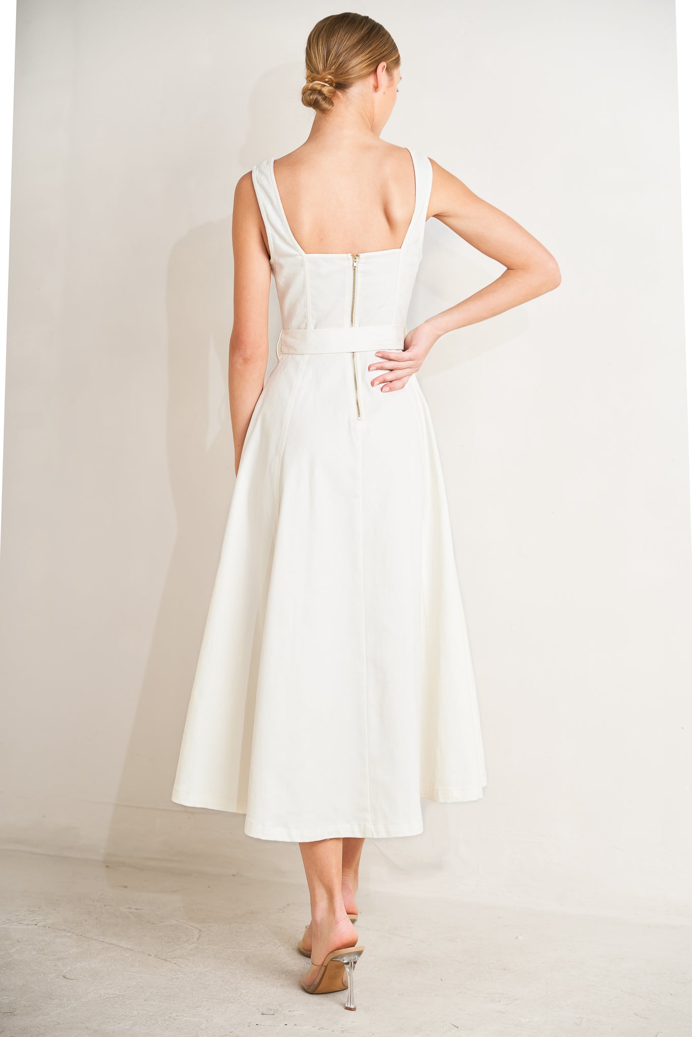 
A solid woven midi dress featuring sweetheart neckline, sleeveless, front button down, self belt and circle skirt

Details:

Self : 97% Cotton 3% Spandex

Size &amp; Fit

- Model is 5`8" And Wearing Size Small
- Measurements Taken From Size Small
- Approx. Length: 49"