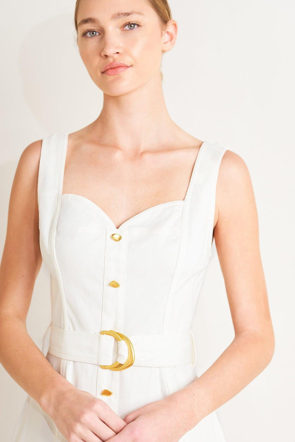 
A solid woven midi dress featuring sweetheart neckline, sleeveless, front button down, self belt and circle skirt

Details:

Self : 97% Cotton 3% Spandex

Size &amp; Fit

- Model is 5`8" And Wearing Size Small
- Measurements Taken From Size Small
- Approx. Length: 49"