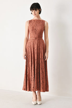 Woman wearing a rust colored lace midi dress featuring wide neckline, sleeveless, self belt, full circle skirt and back zipper closure | FREEMARKET