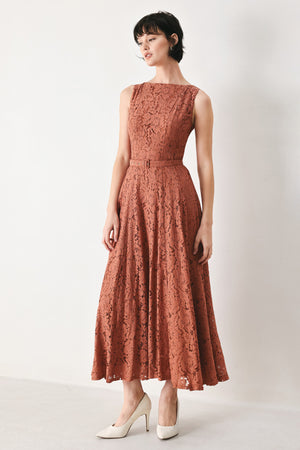 Woman wearing a rust colored lace midi dress featuring wide neckline, sleeveless, self belt, full circle skirt and back zipper closure | FREEMARKET