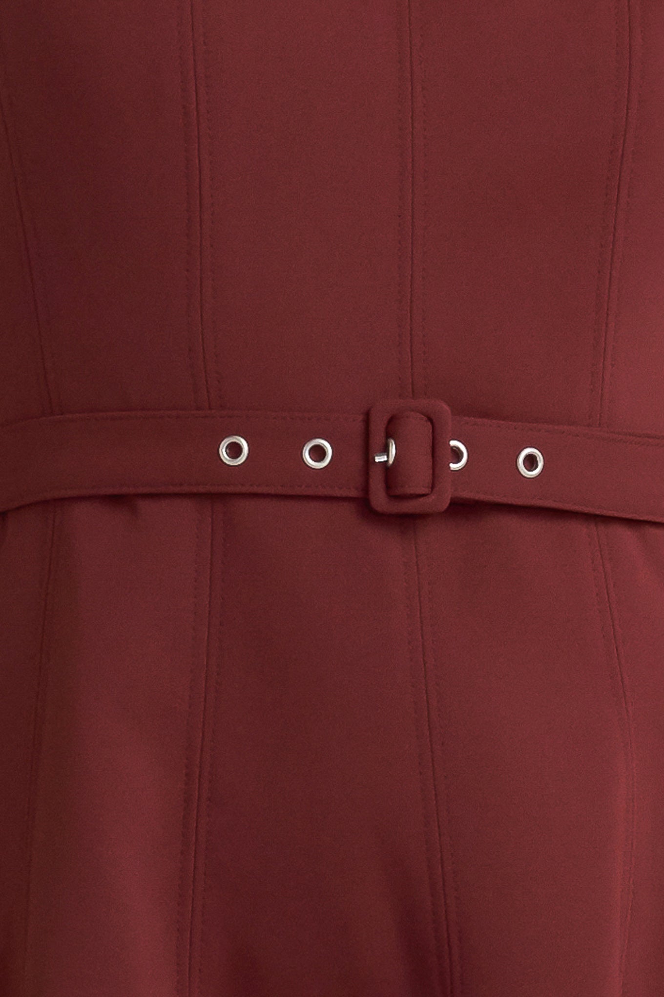 A solid woven midi dress featuring boat neckline, sleeveless, full skirt, self belt, side pocket and full skirt