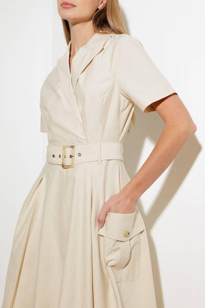 A solid woven midi dress featuring a surplice neckline with collar, short sleeve, self-belt, full skirt with side pocket, and full skirt

Details:

Self: 100% Cotton

Size &amp; Fit

- Model is 5`8" And Wearing Size Small
- Measurements Taken From Size Small
- Approx. Length: 52" FLYING TOMATO