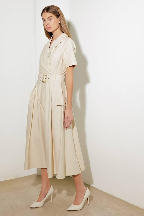 A solid woven midi dress featuring a surplice neckline with collar, short sleeve, self-belt, full skirt with side pocket, and full skirt

Details:

Self: 100% Cotton

Size &amp; Fit

- Model is 5`8" And Wearing Size Small
- Measurements Taken From Size Small
- Approx. Length: 52" FLYING TOMATO