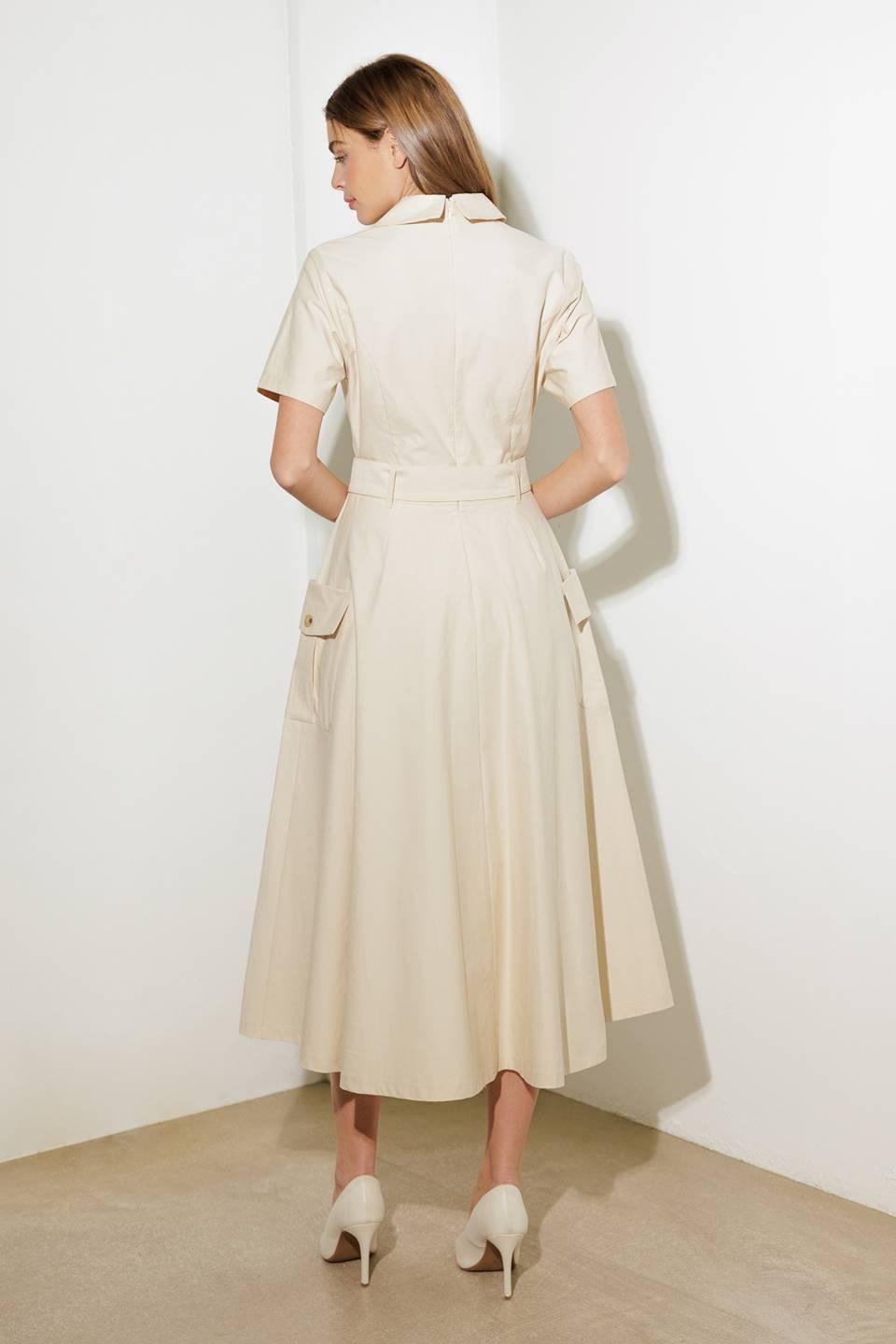 A solid woven midi dress featuring a surplice neckline with collar, short sleeve, self-belt, full skirt with side pocket, and full skirt

Details:

Self: 100% Cotton

Size &amp; Fit

- Model is 5`8" And Wearing Size Small
- Measurements Taken From Size Small
- Approx. Length: 52" FLYING TOMATO