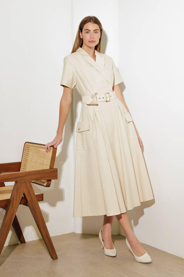 A solid woven midi dress featuring a surplice neckline with collar, short sleeve, self-belt, full skirt with side pocket, and full skirt

Details:

Self: 100% Cotton

Size &amp; Fit

- Model is 5`8" And Wearing Size Small
- Measurements Taken From Size Small
- Approx. Length: 52" FLYING TOMATO