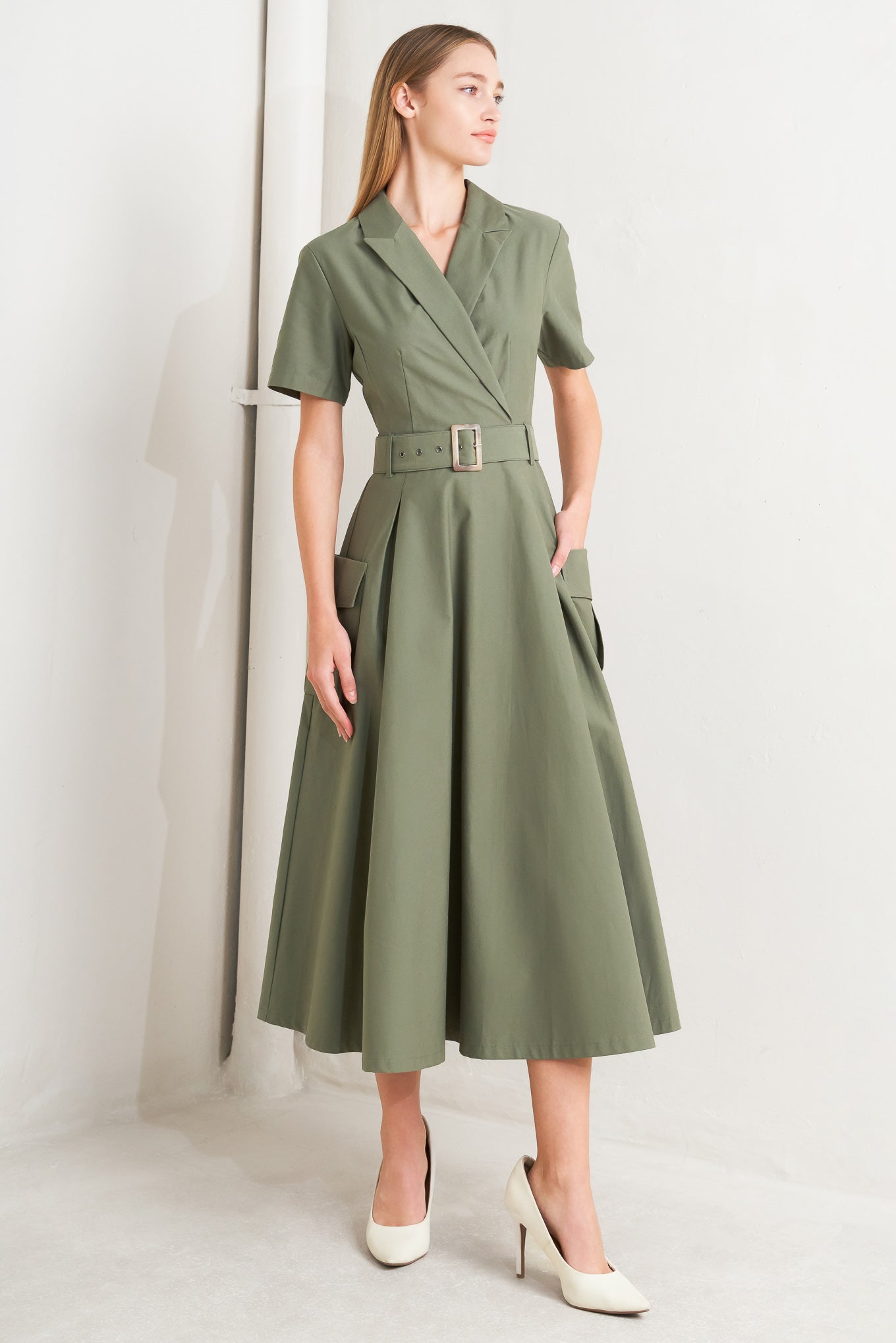 A solid woven midi dress featuring a surplice neckline with collar, short sleeve, self-belt, full skirt with side pocket, and full skirt

Details:

Self: 100% Cotton

Size &amp; Fit

- Model is 5`8" And Wearing Size Small
- Measurements Taken From Size Small
- Approx. Length: 52" FLYING TOMATO