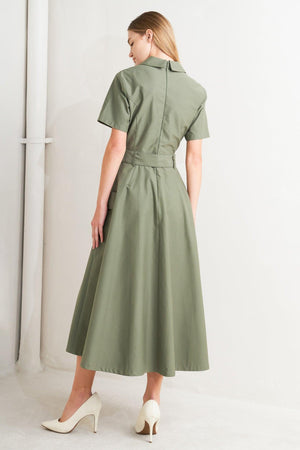 A solid woven midi dress featuring a surplice neckline with collar, short sleeve, self-belt, full skirt with side pocket, and full skirt

Details:

Self: 100% Cotton

Size &amp; Fit

- Model is 5`8" And Wearing Size Small
- Measurements Taken From Size Small
- Approx. Length: 52" FLYING TOMATO