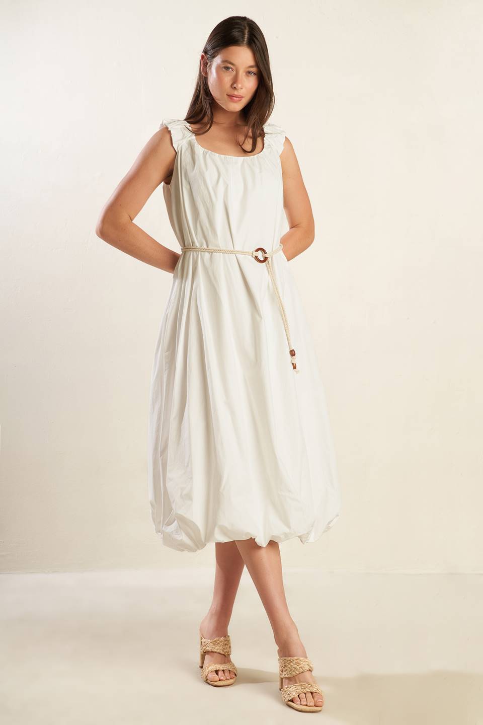 A solid off-white woven midi dress featuring U neckline, ruched shoulder strap, contrasting belt and bubble hemline.