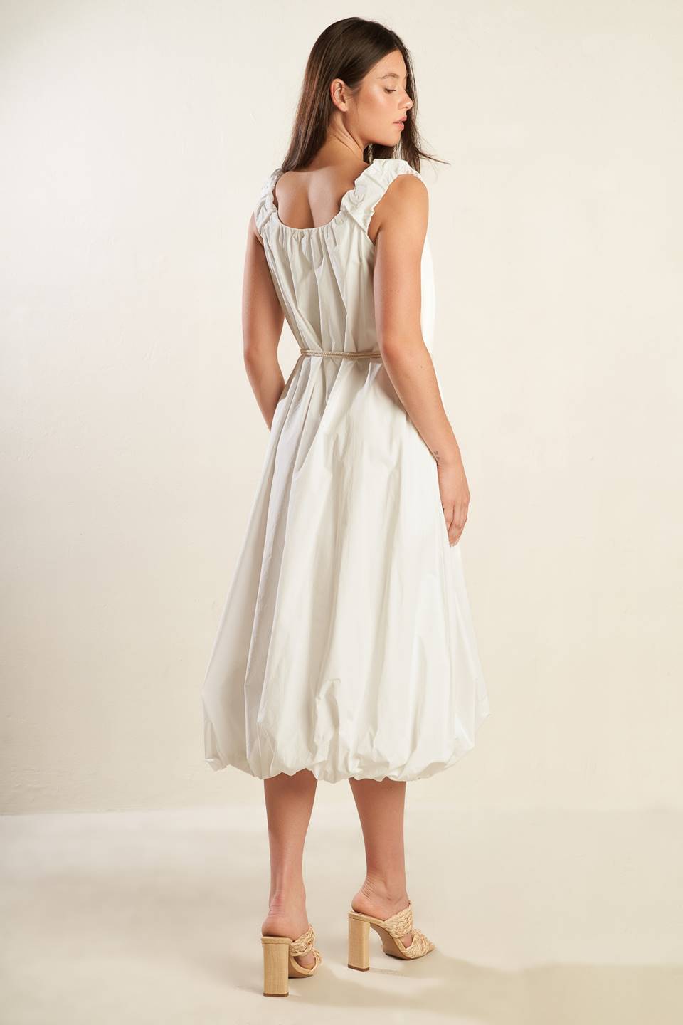 A solid off-white woven midi dress featuring U neckline, ruched shoulder strap, contrasting belt and bubble hemline.