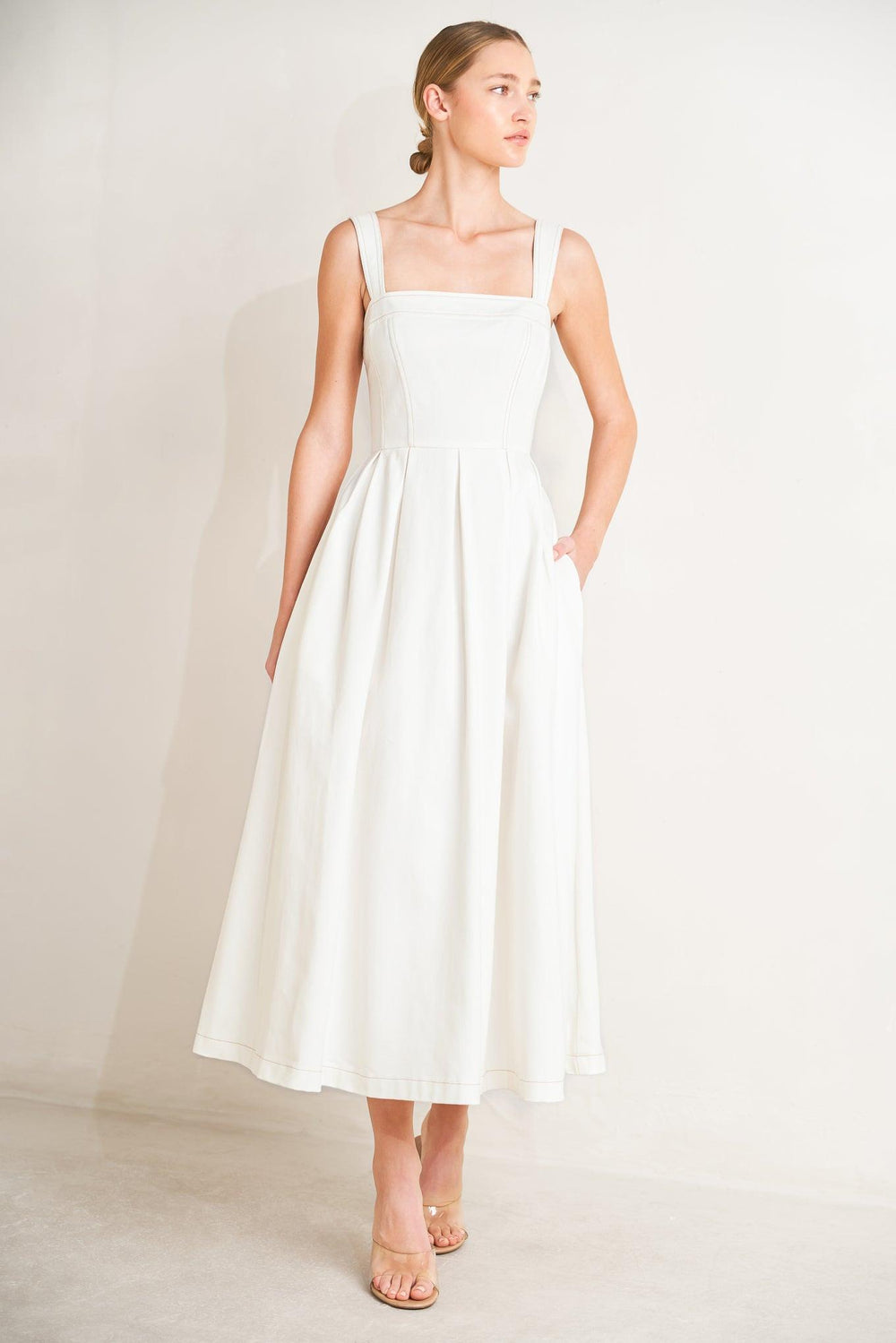 
A solid woven midi dress featuring straight neckline, straps, full skirt and back zipper closure

Details:

Self : 100% Cotton

Size &amp; Fit

- Model is 5`8" And Wearing Size Small
- Measurements Taken From Size Small
- Approx. Length: 50"